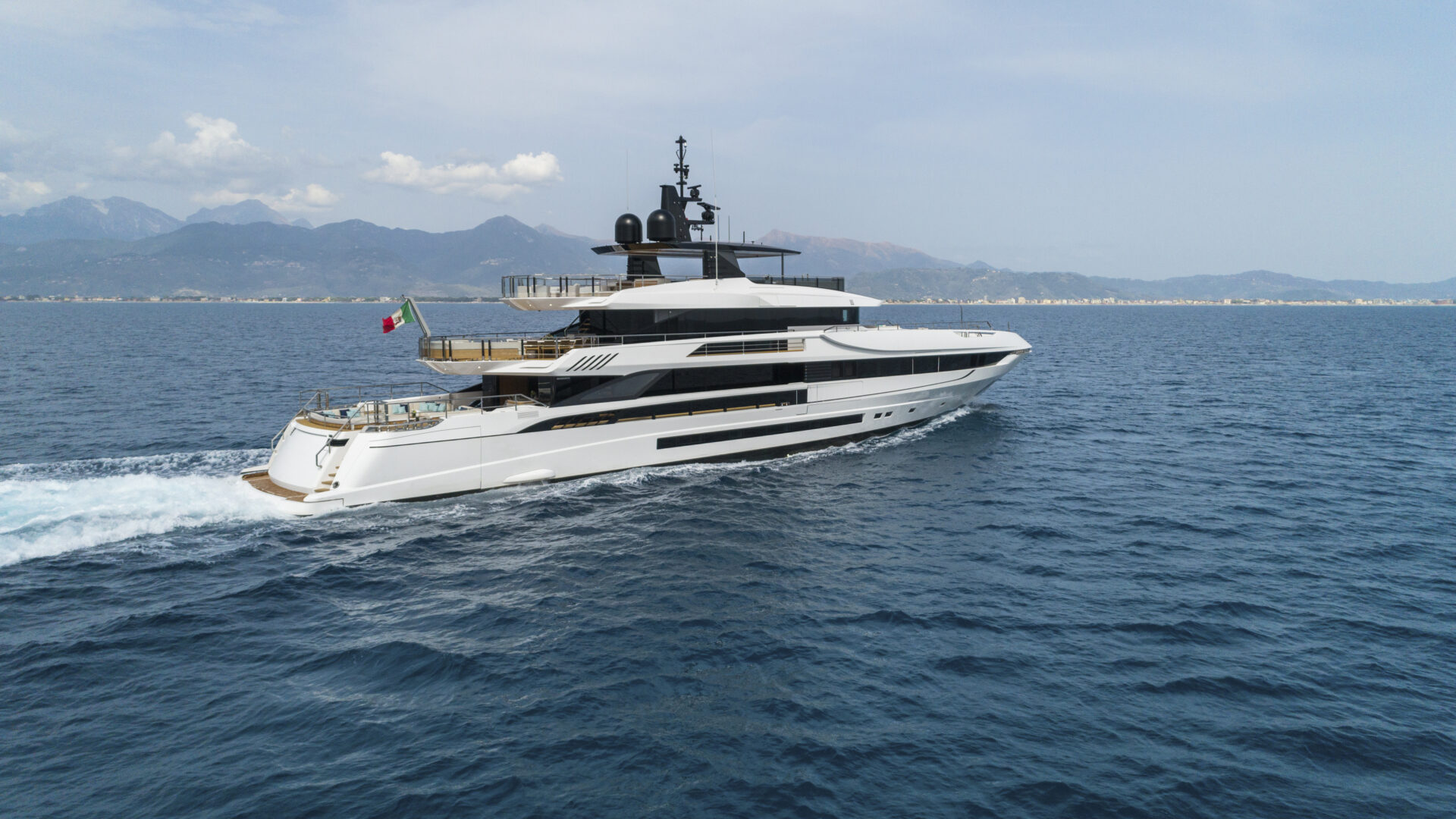 Mangusta yacht cruising in open sea.