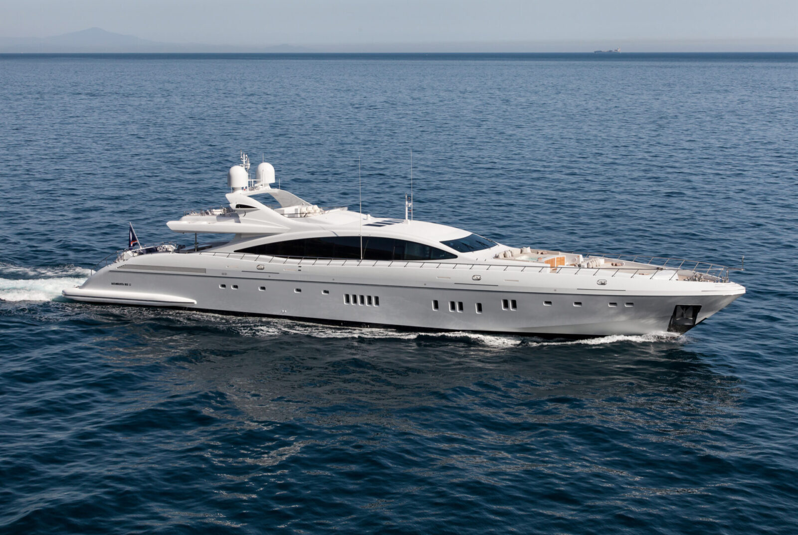 Mangusta yacht cruising on open sea.