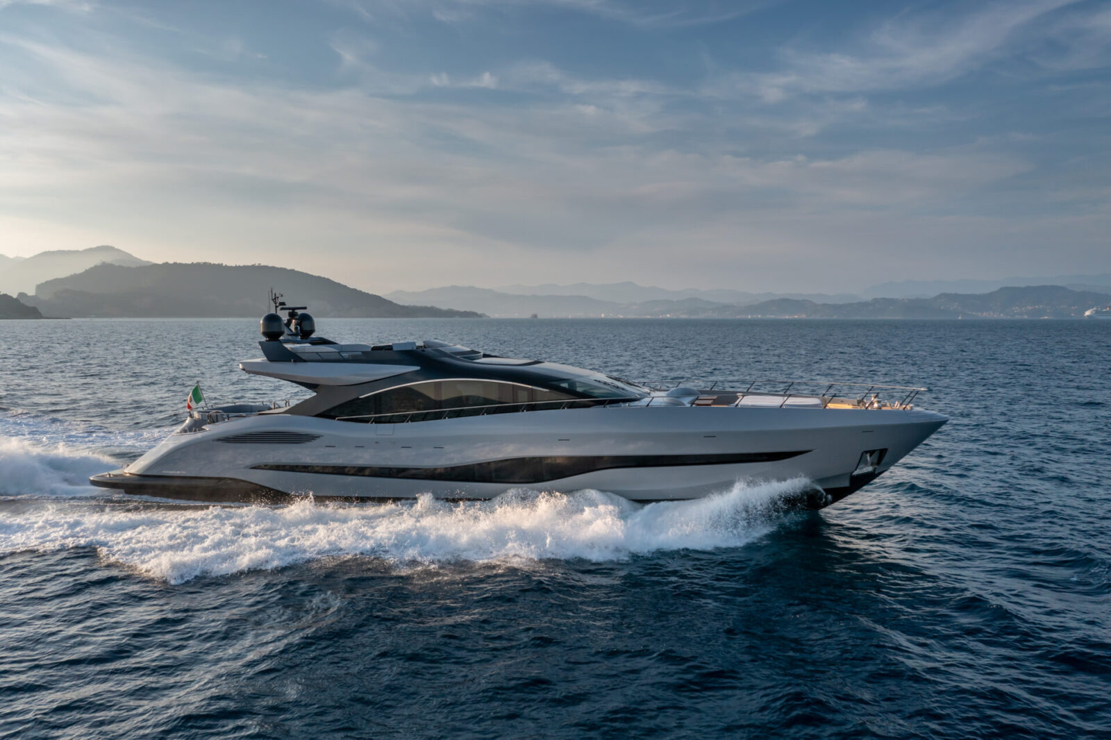 Luxury Mangusta yacht cruising at high speed.