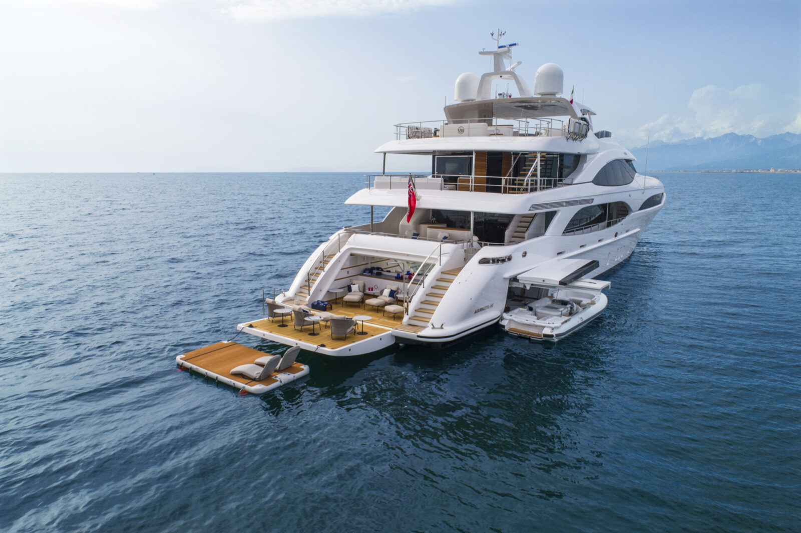 Luxurious Mangusta yacht on open sea.