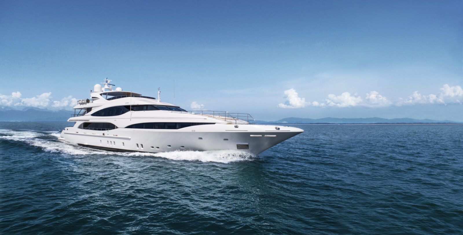 Luxurious Mangusta yacht cruising at sea