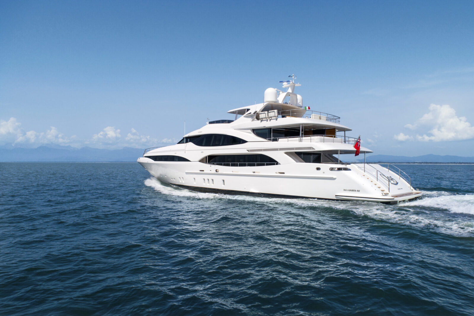 Mangusta yacht cruising on open sea.