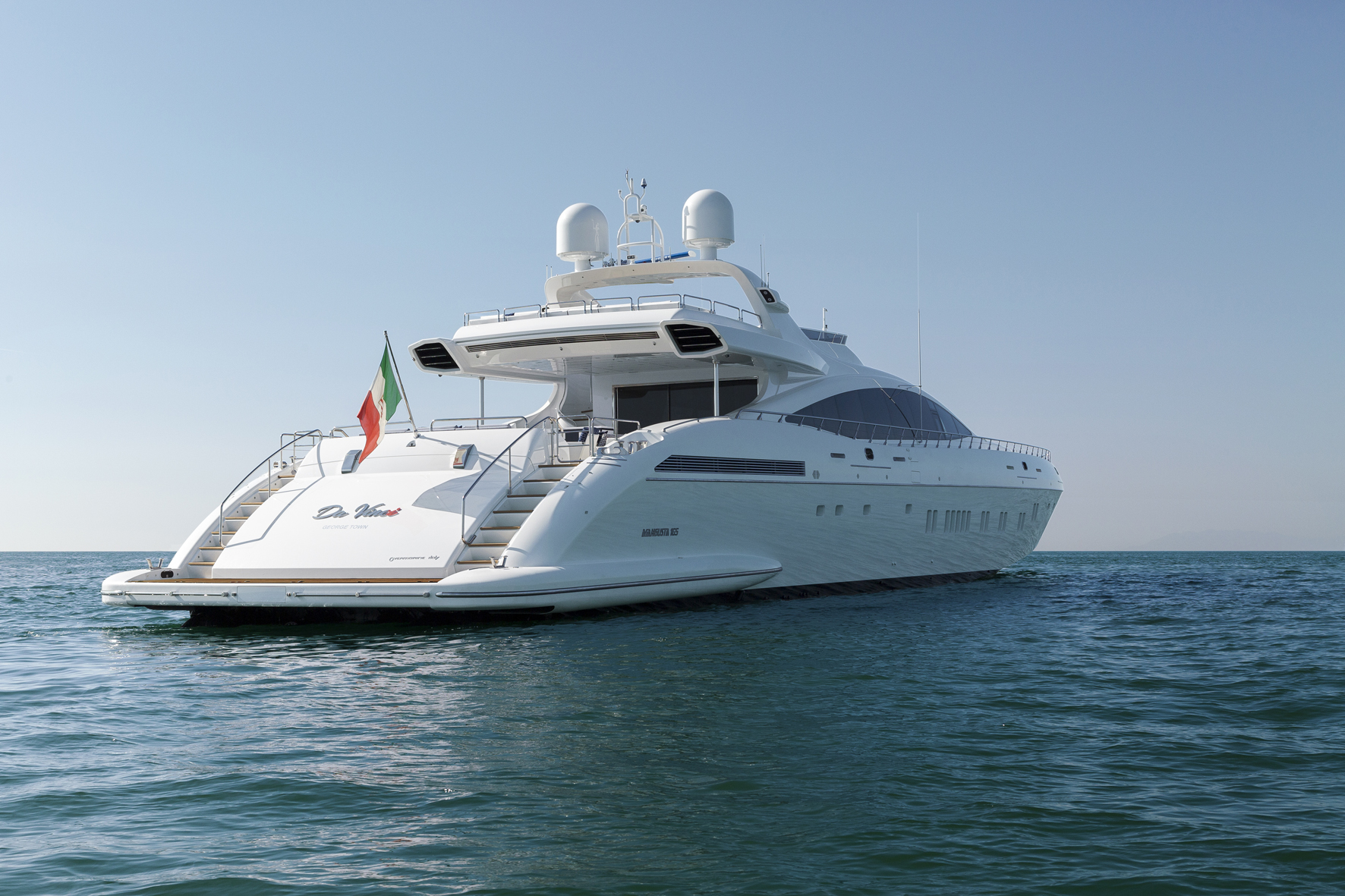 Mangusta Yacht 165 on open sea with Italian flag