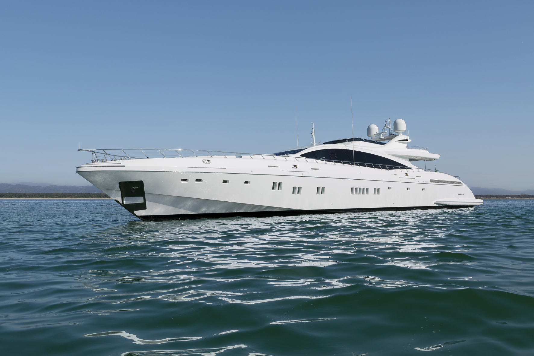 Mangusta Yachts luxury white yacht on open ocean