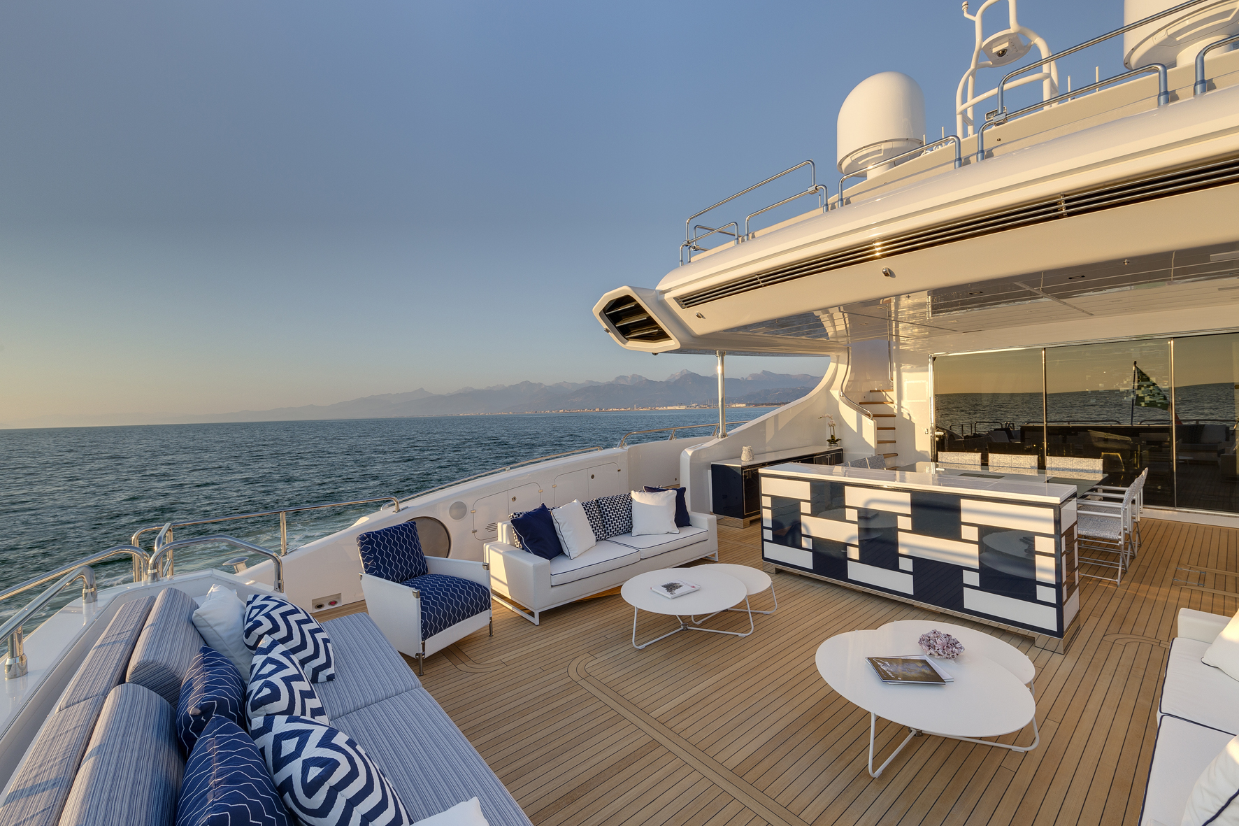 Luxury yacht deck with modern lounge area.