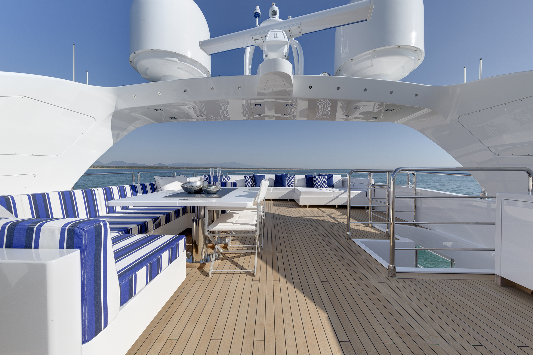 Luxury deck on Mangusta Yacht with blue seating