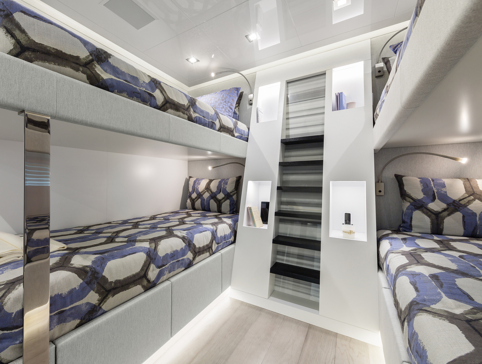 Luxury yacht cabin with modern bunk beds