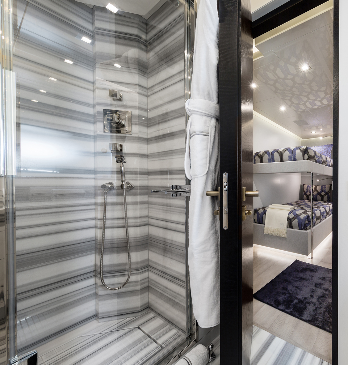 Luxurious Mangusta Yachts cabin shower and bunk beds