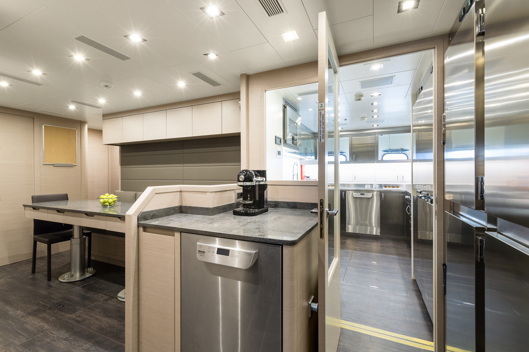 Luxurious yacht kitchen interior with modern appliances.