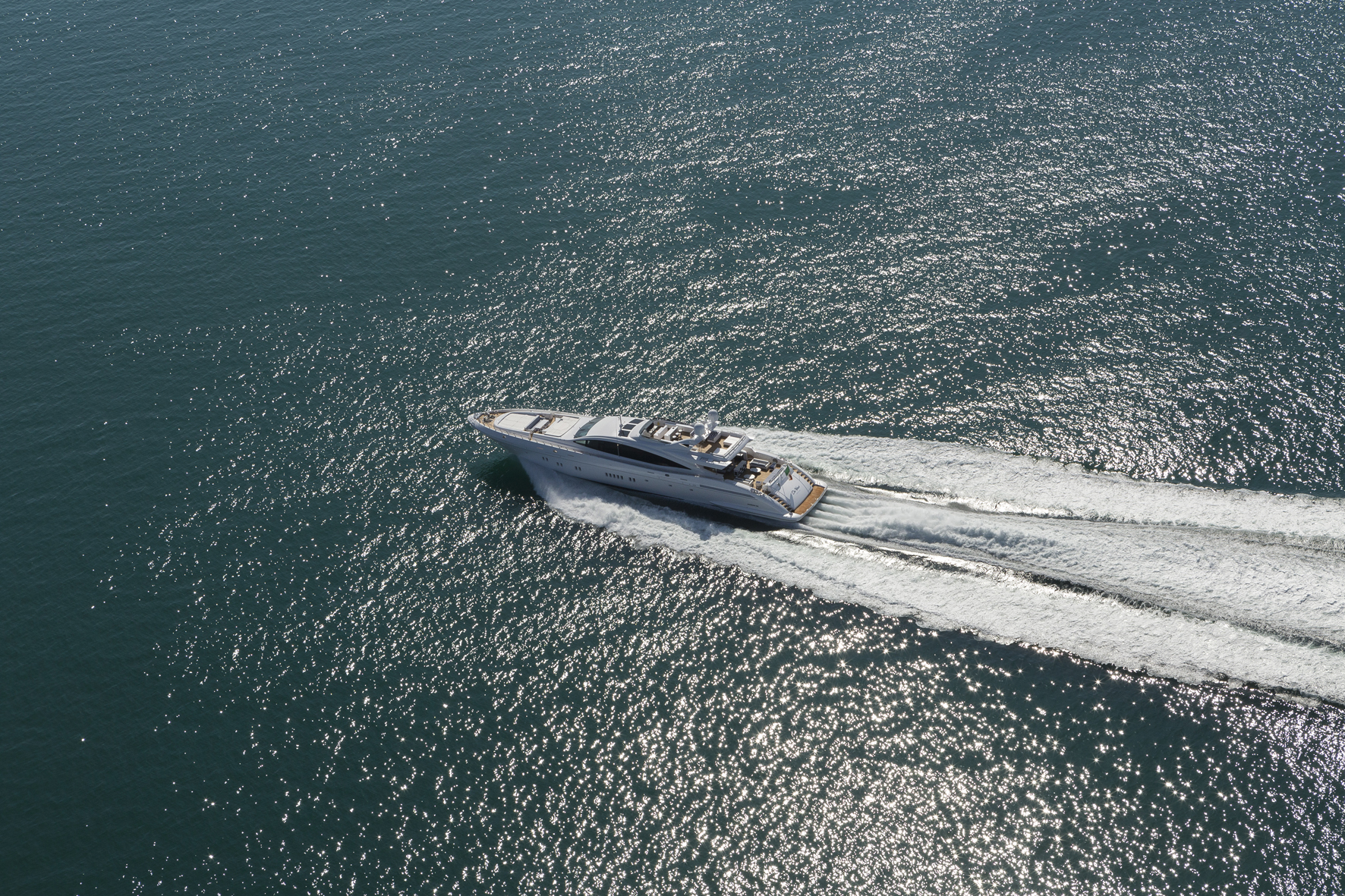 Mangusta yacht cruising on open sea.