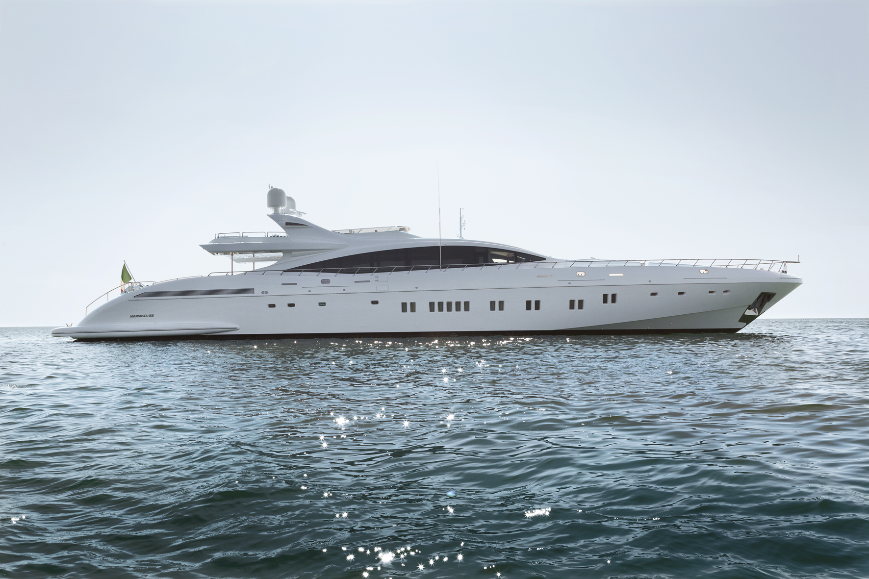 Mangusta yacht cruising on open sea.