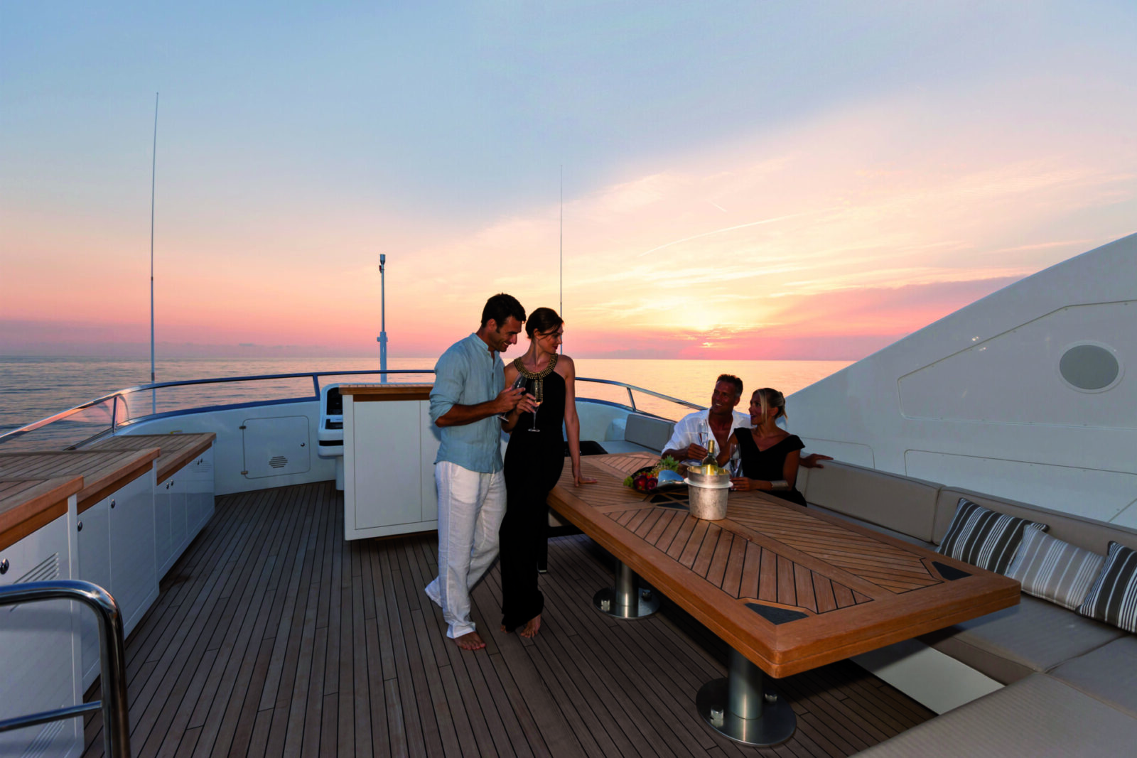 Luxury yacht sunset gathering on Mangusta deck