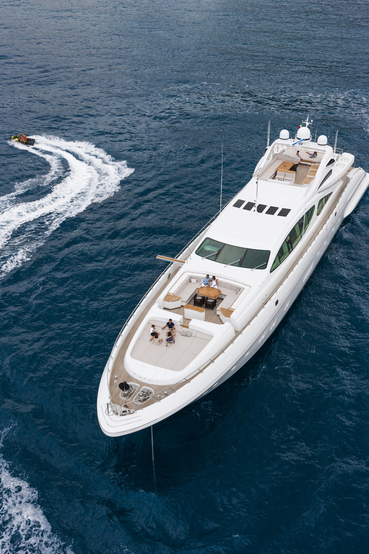 Mangusta Yacht Cruising with Jet Ski Nearby