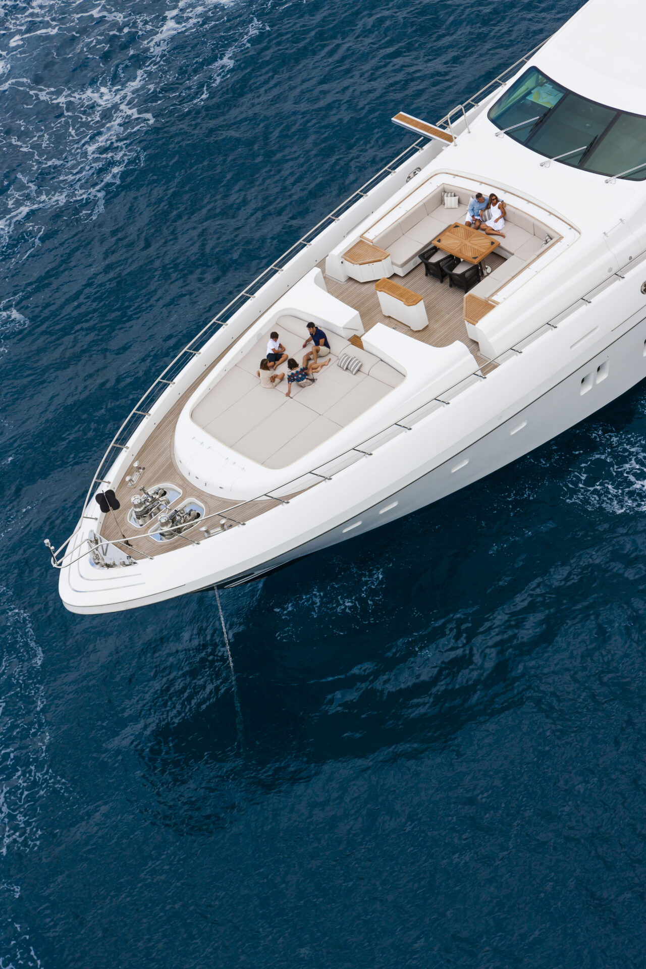 Mangusta yacht deck with people relaxing at sea