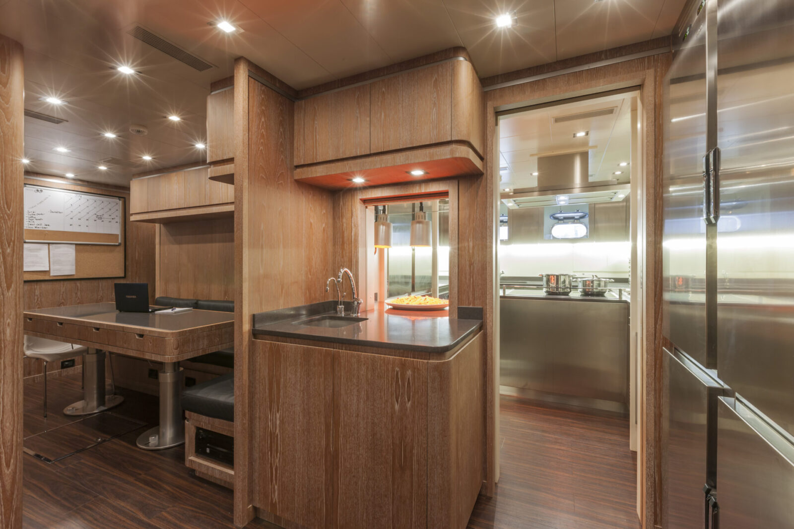 Luxurious yacht interior with modern kitchen.