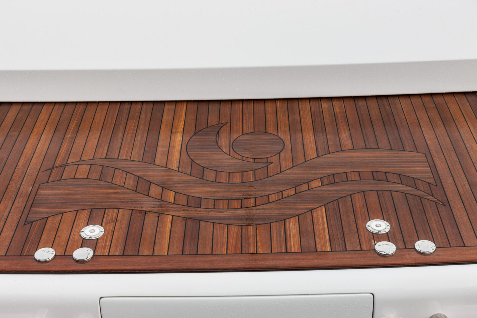 Teak deck with Mangusta Yachts logo engraving