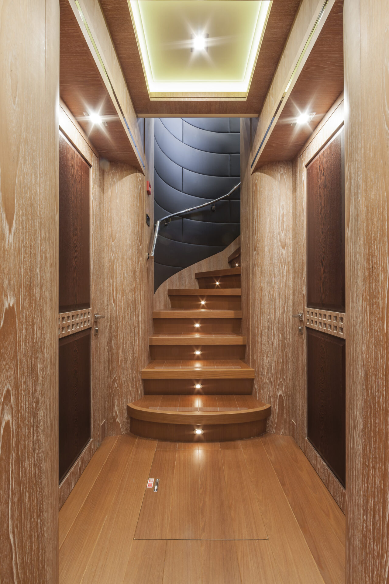Luxury yacht wooden staircase with modern lighting