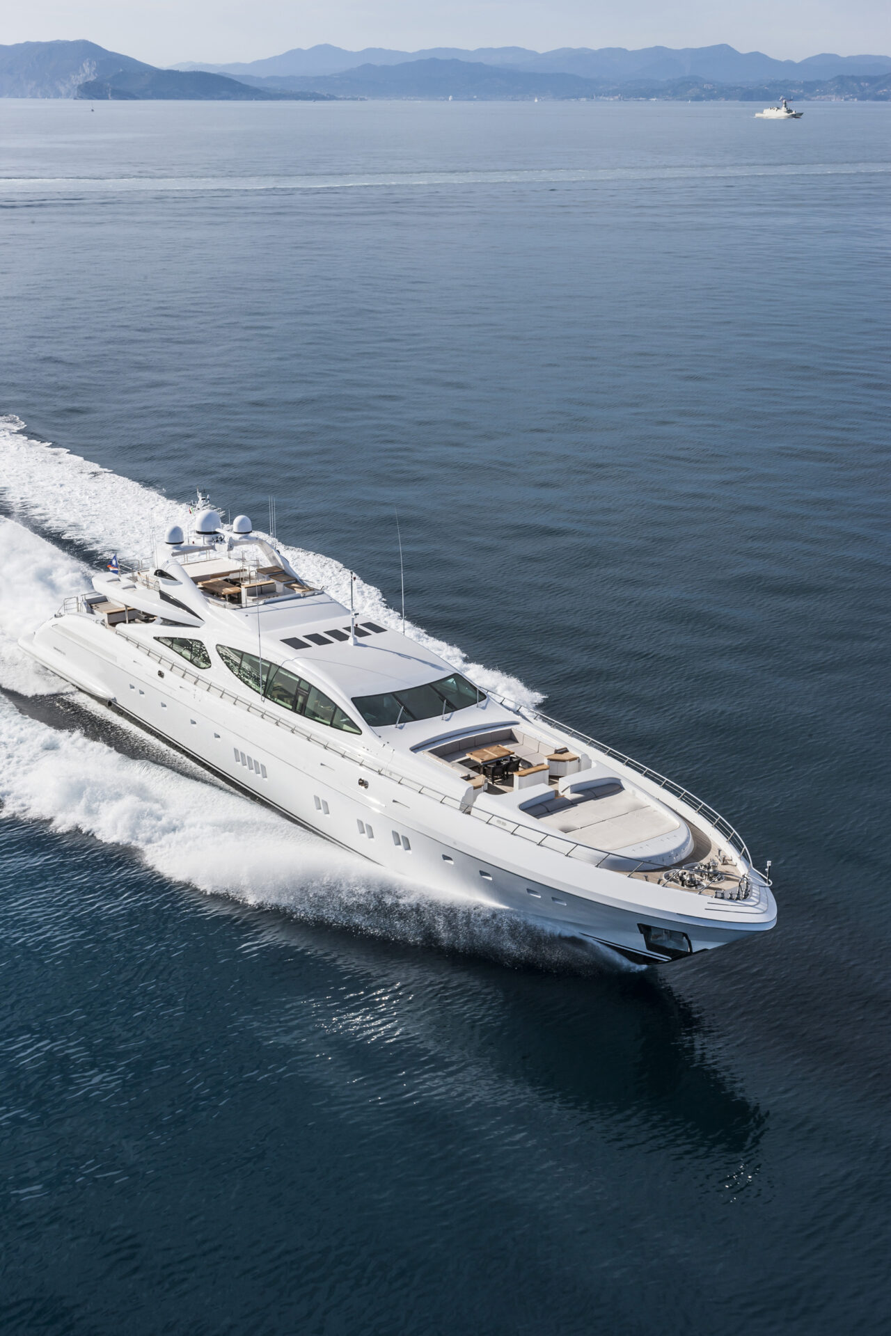 Luxury Mangusta yacht cruising the sea.