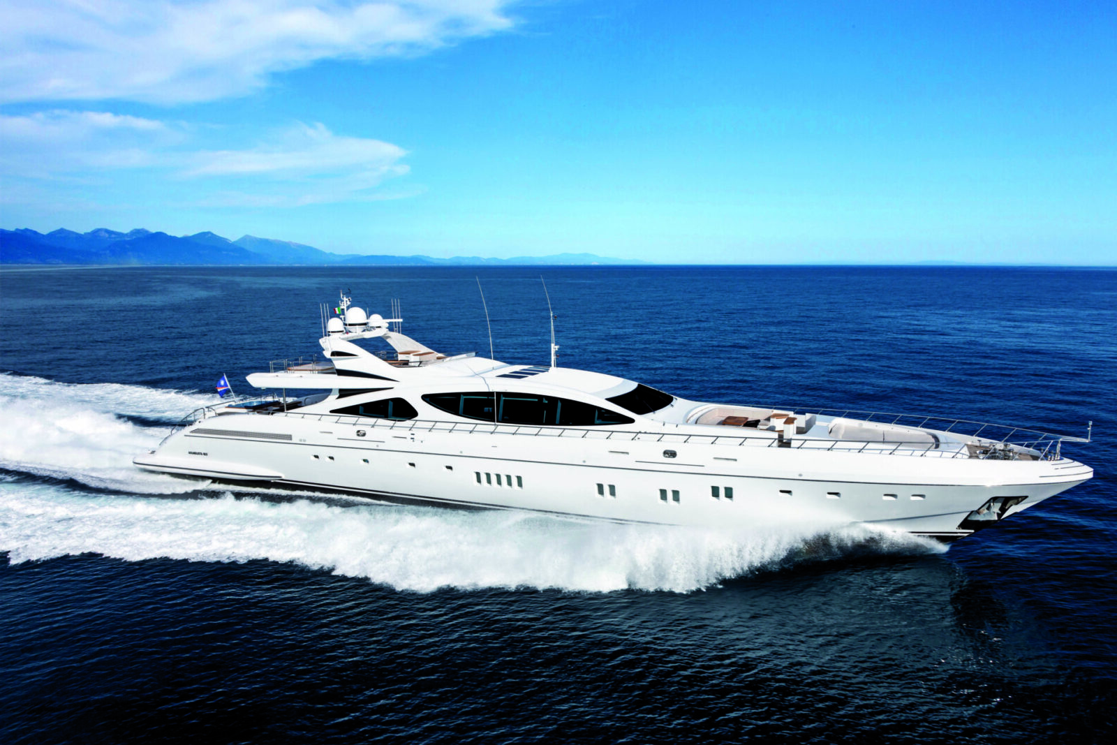 Mangusta yacht cruising on open sea.
