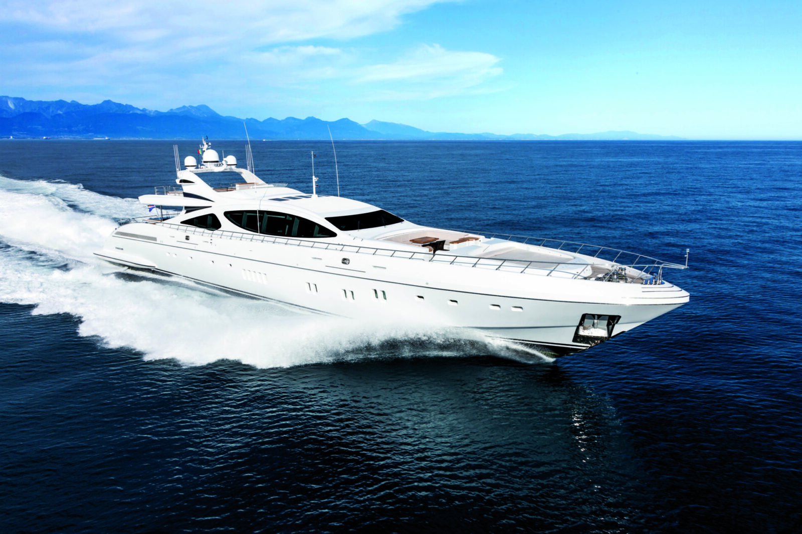 Mangusta yacht cruising on open sea.