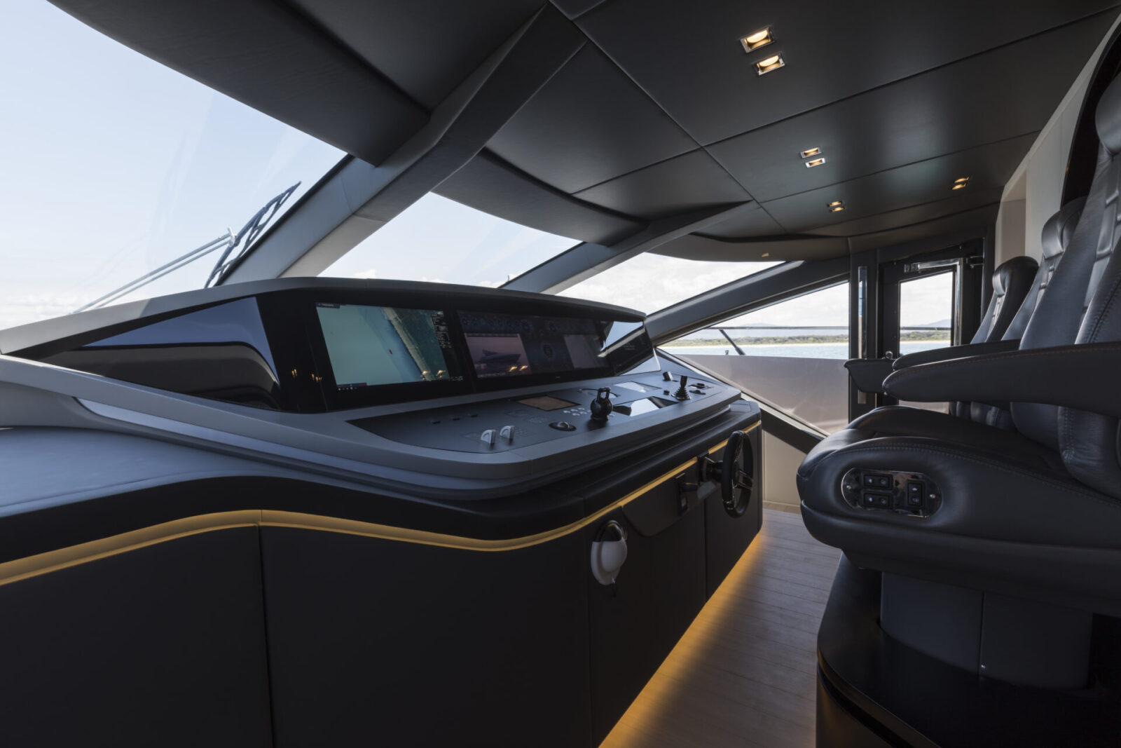 Luxury yacht helm with modern dashboard.