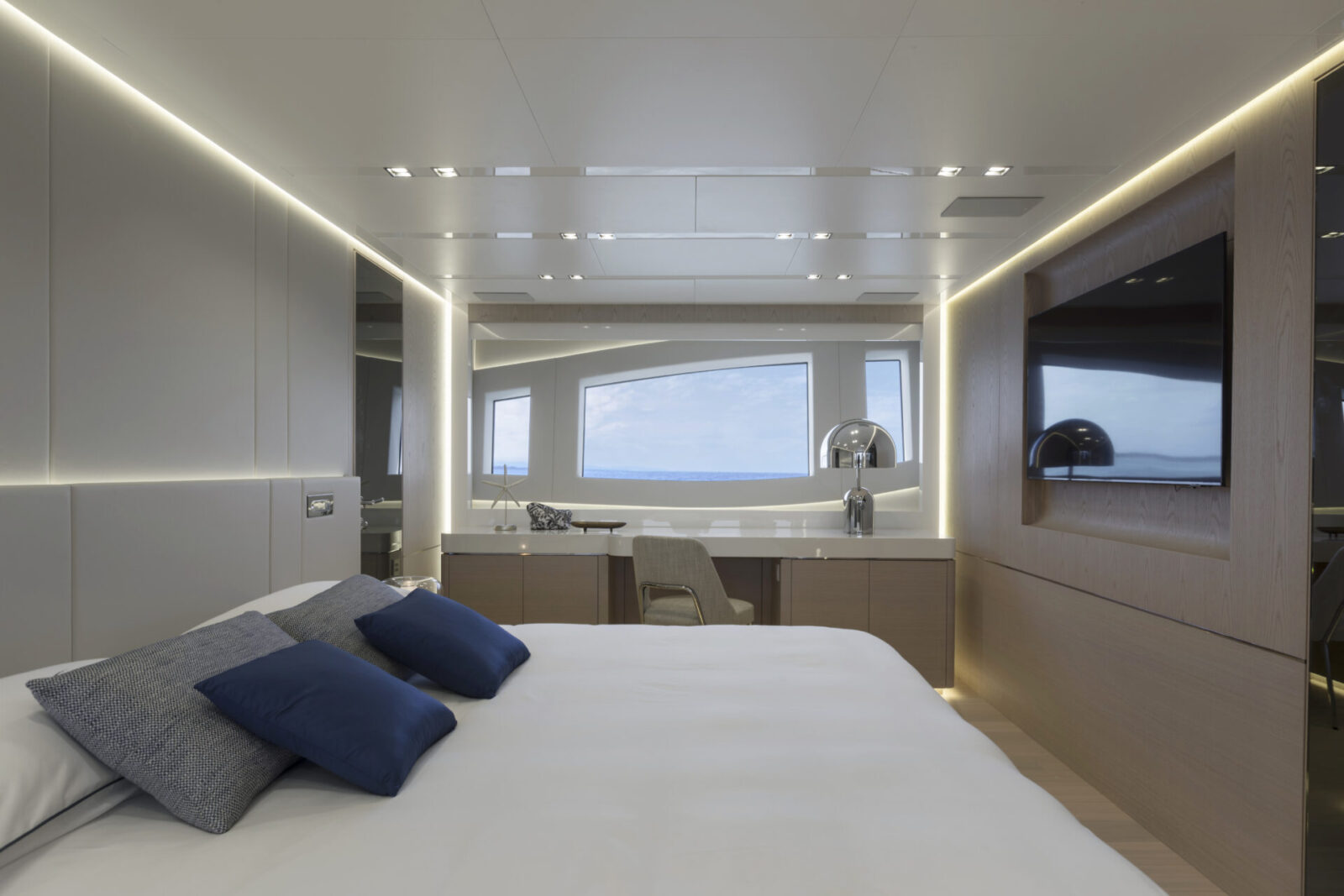 Luxury yacht bedroom with ocean view window