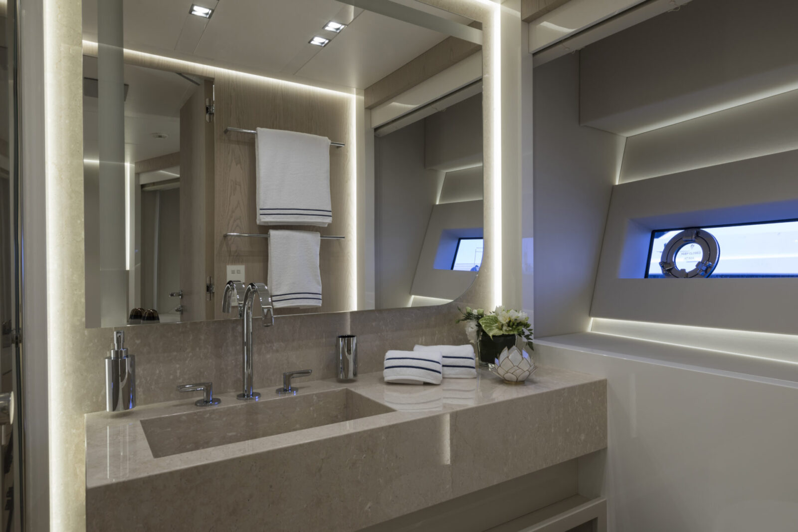 Luxurious bathroom in Mangusta yacht with LED lighting.
