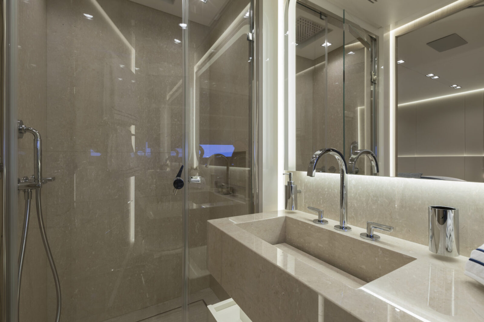Luxurious yacht bathroom with marble finishes.