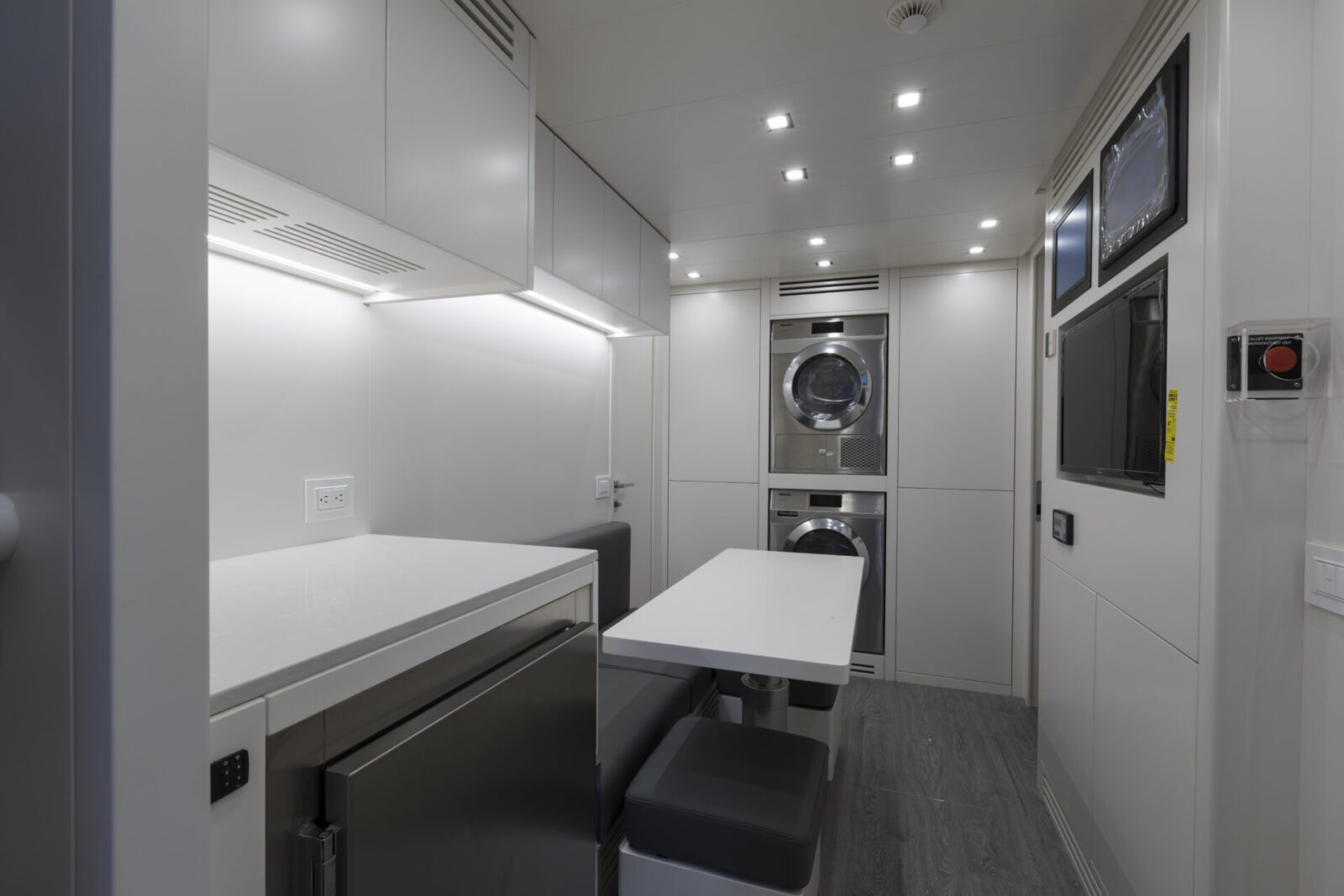 Yacht laundry room with modern appliances.