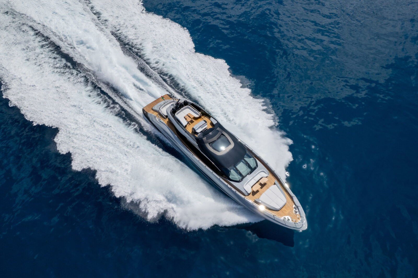 Mangusta yacht cruising on open blue sea