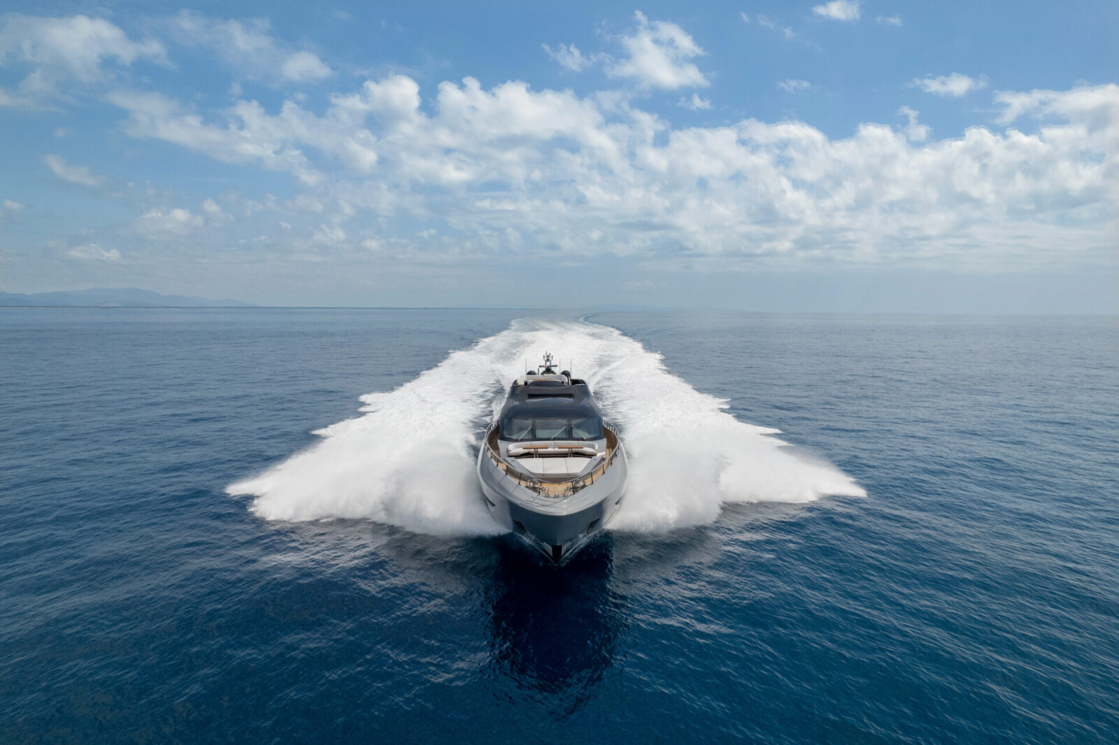 Mangusta yacht gliding on the open sea.