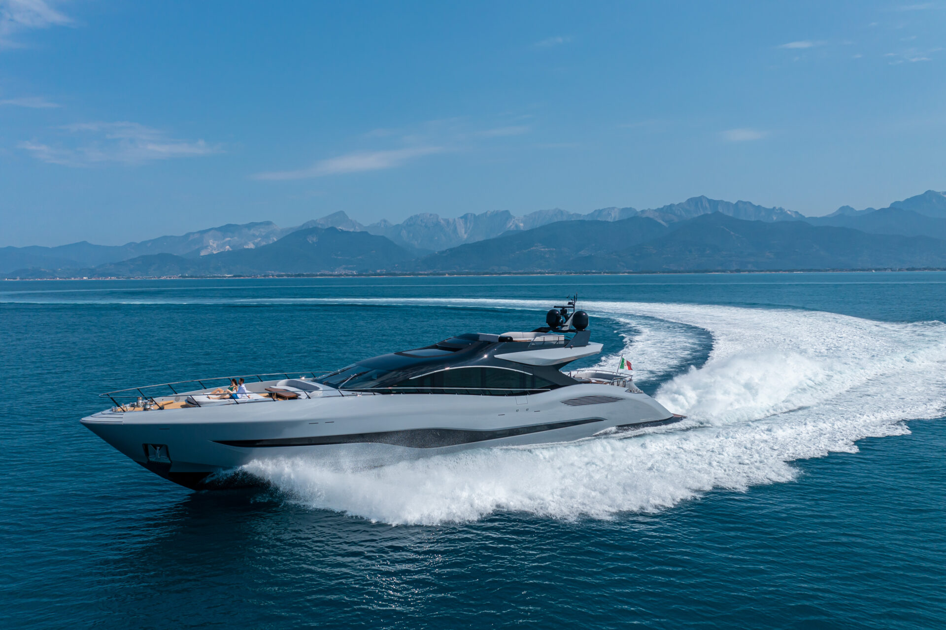 Mangusta yacht cruising on a sunny sea day