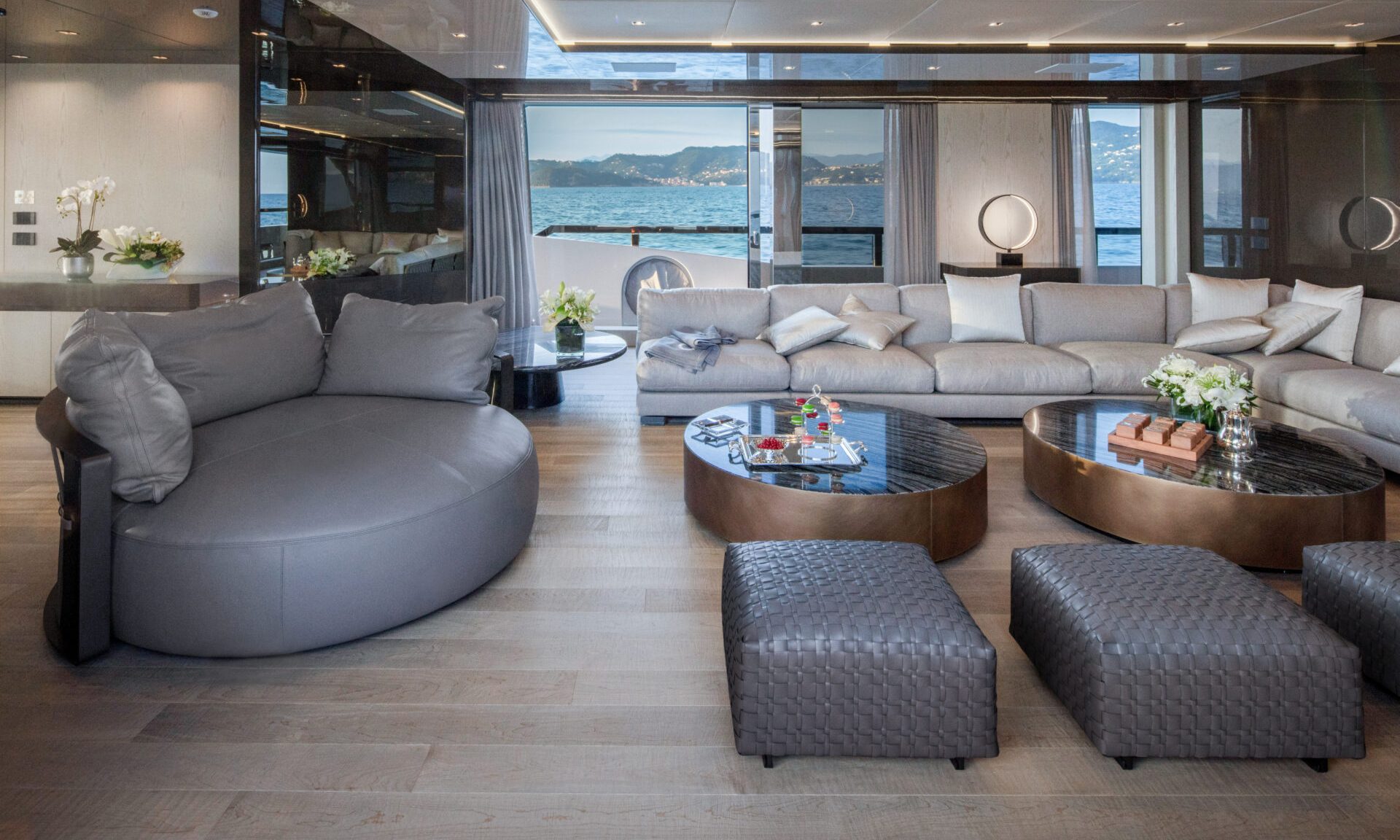 Luxurious yacht lounge with sea view.