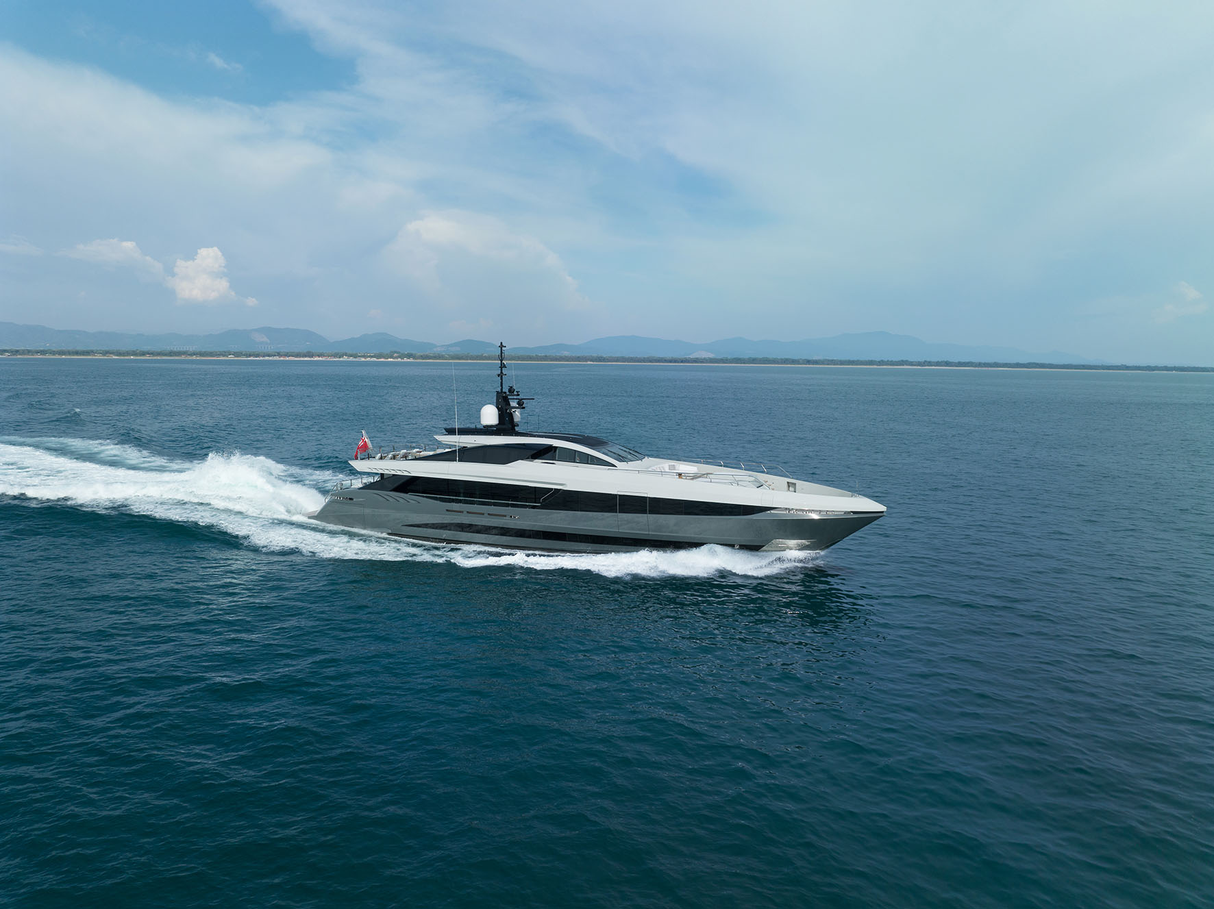 Mangusta yacht cruising in open sea.