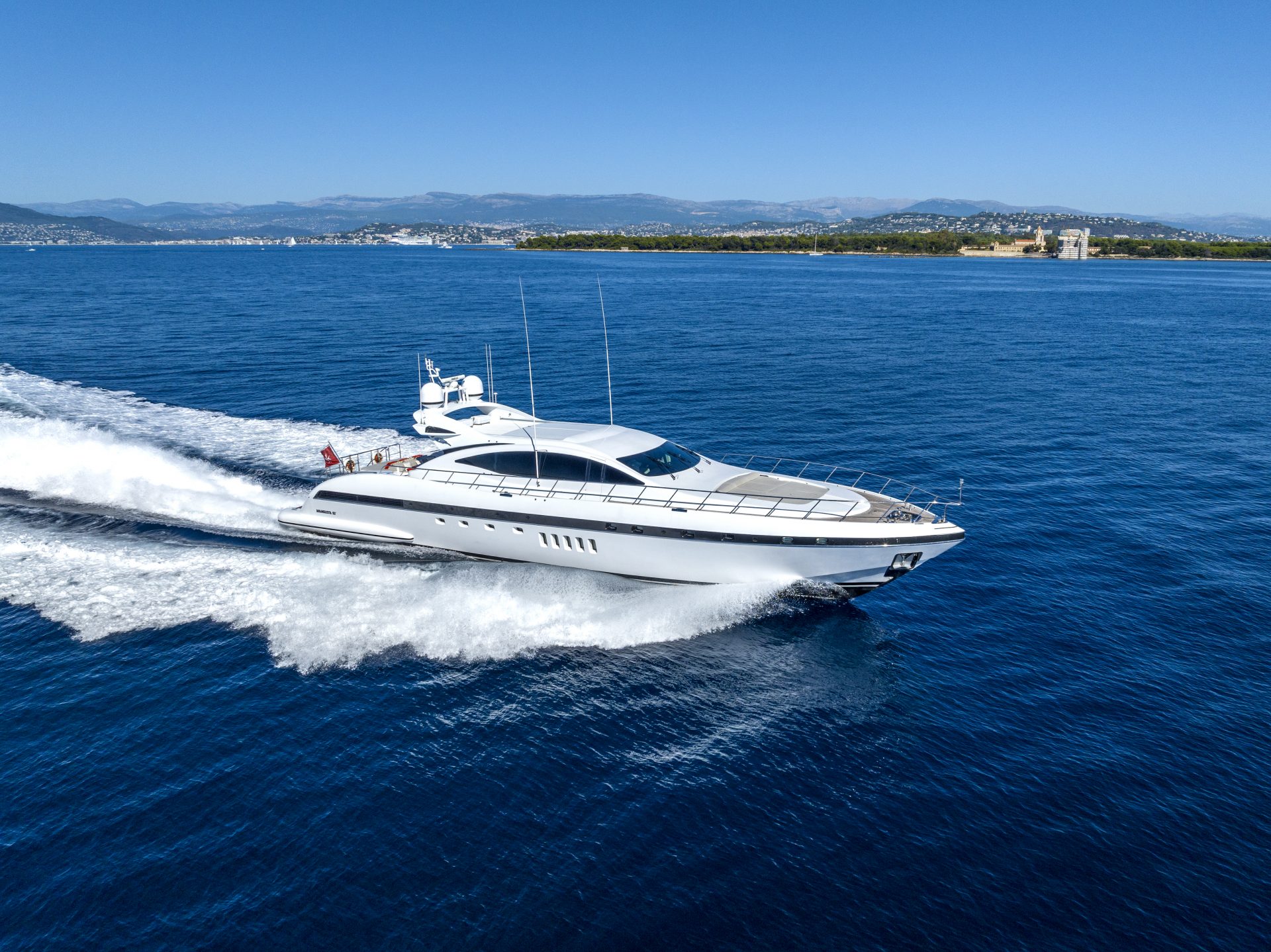 Mangusta yacht cruising on open sea.
