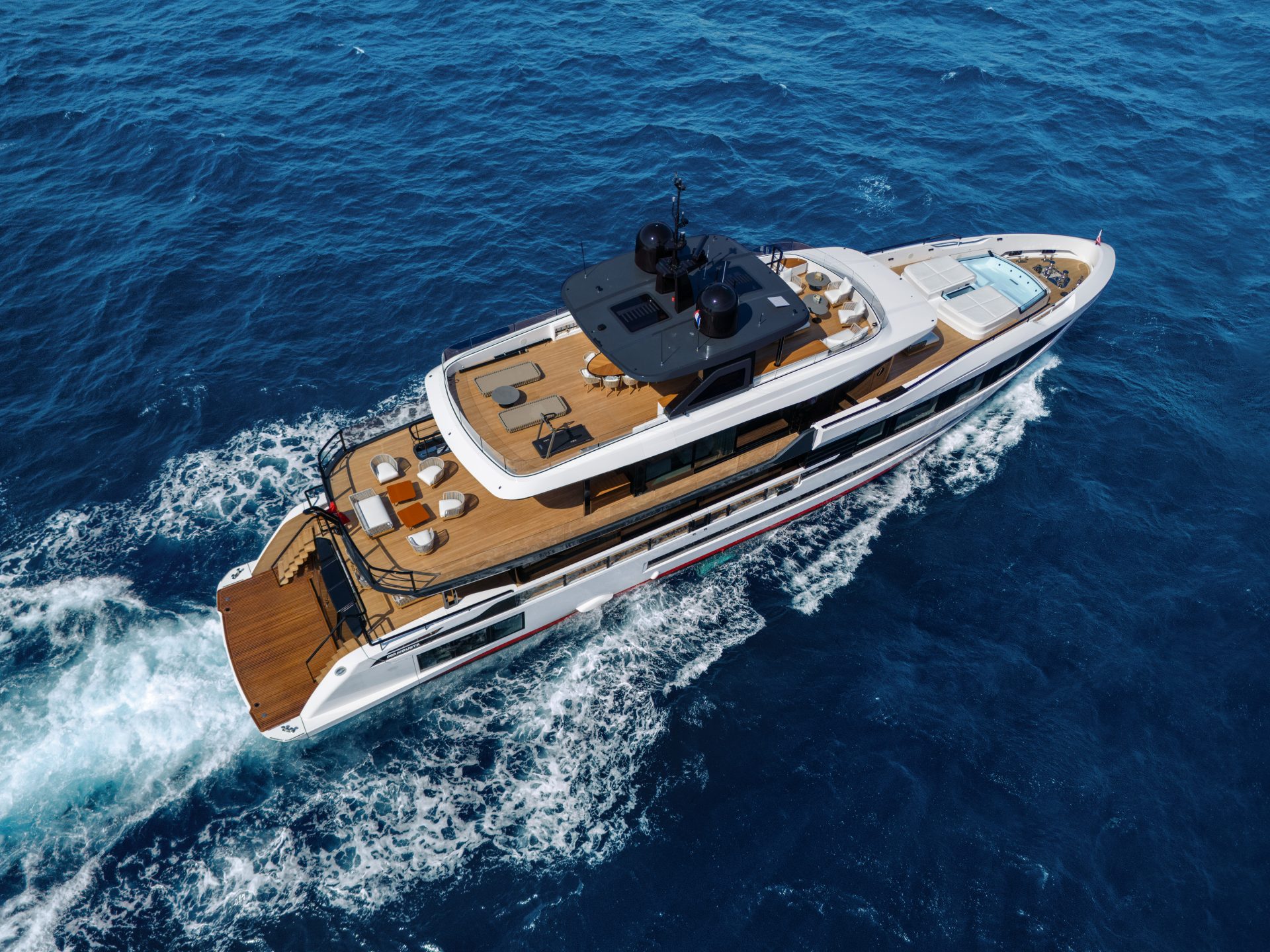 Mangusta luxury yacht cruising above blue sea