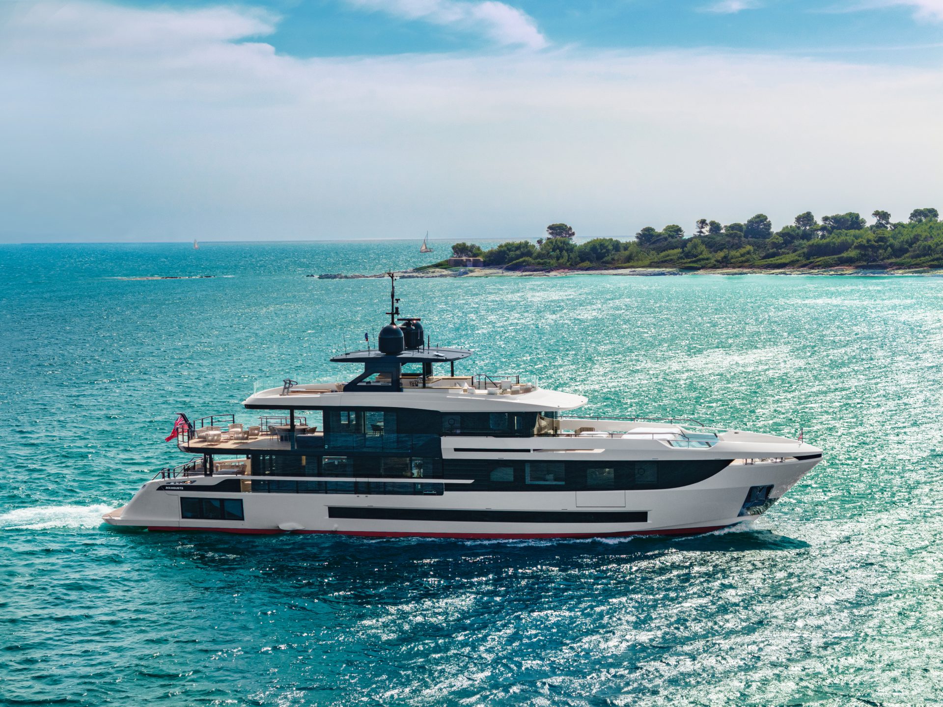 Luxurious Mangusta yacht cruising turquoise waters