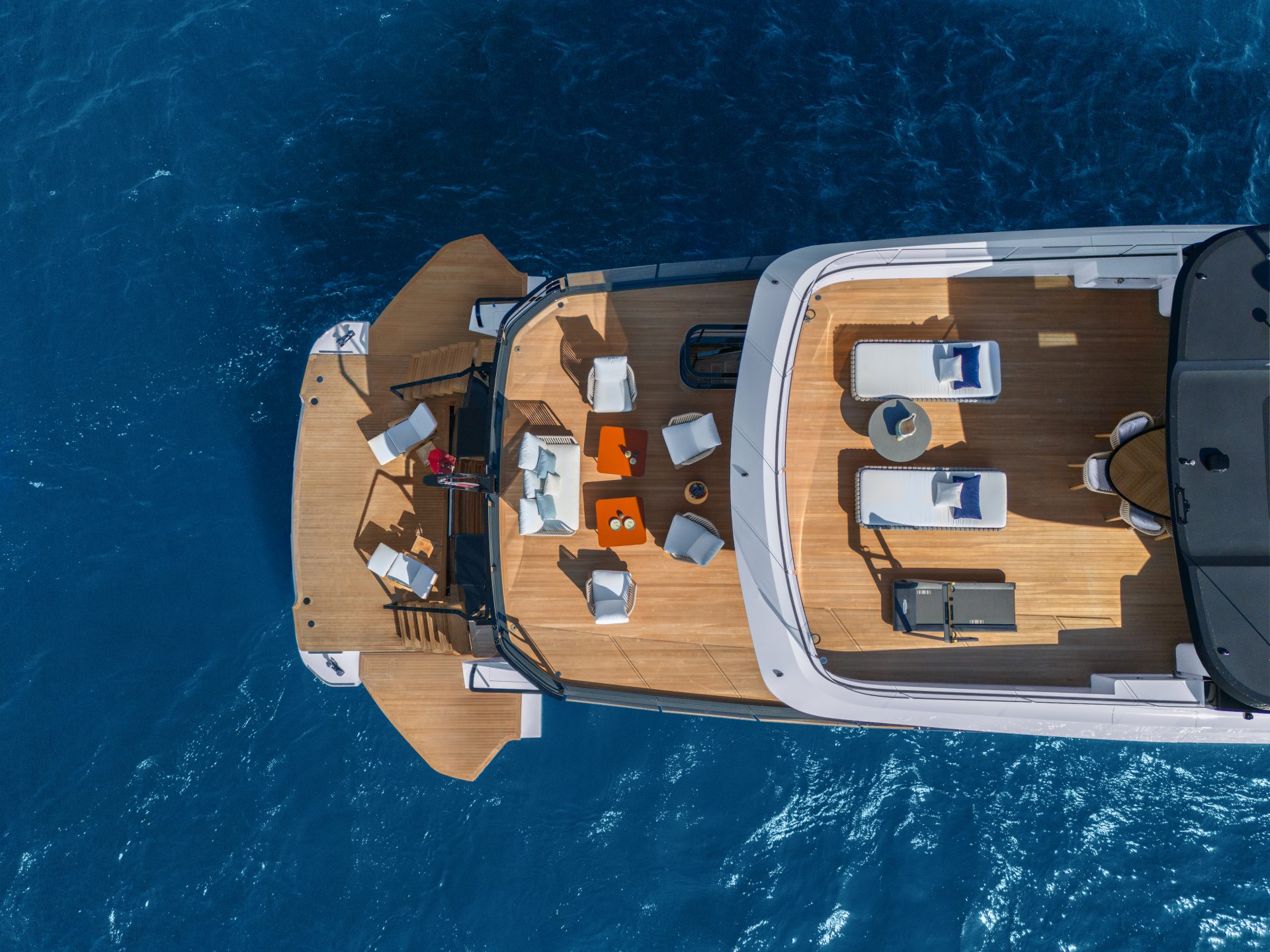 Luxurious Mangusta yacht deck with lounge chairs