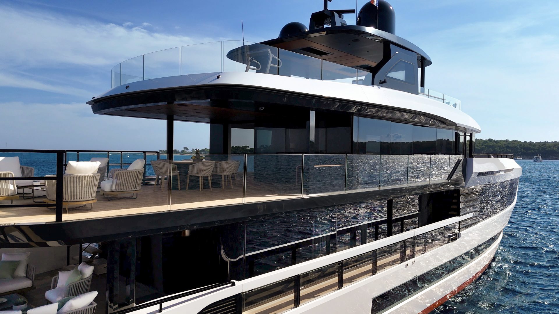 Luxury Mangusta yacht on blue sea.