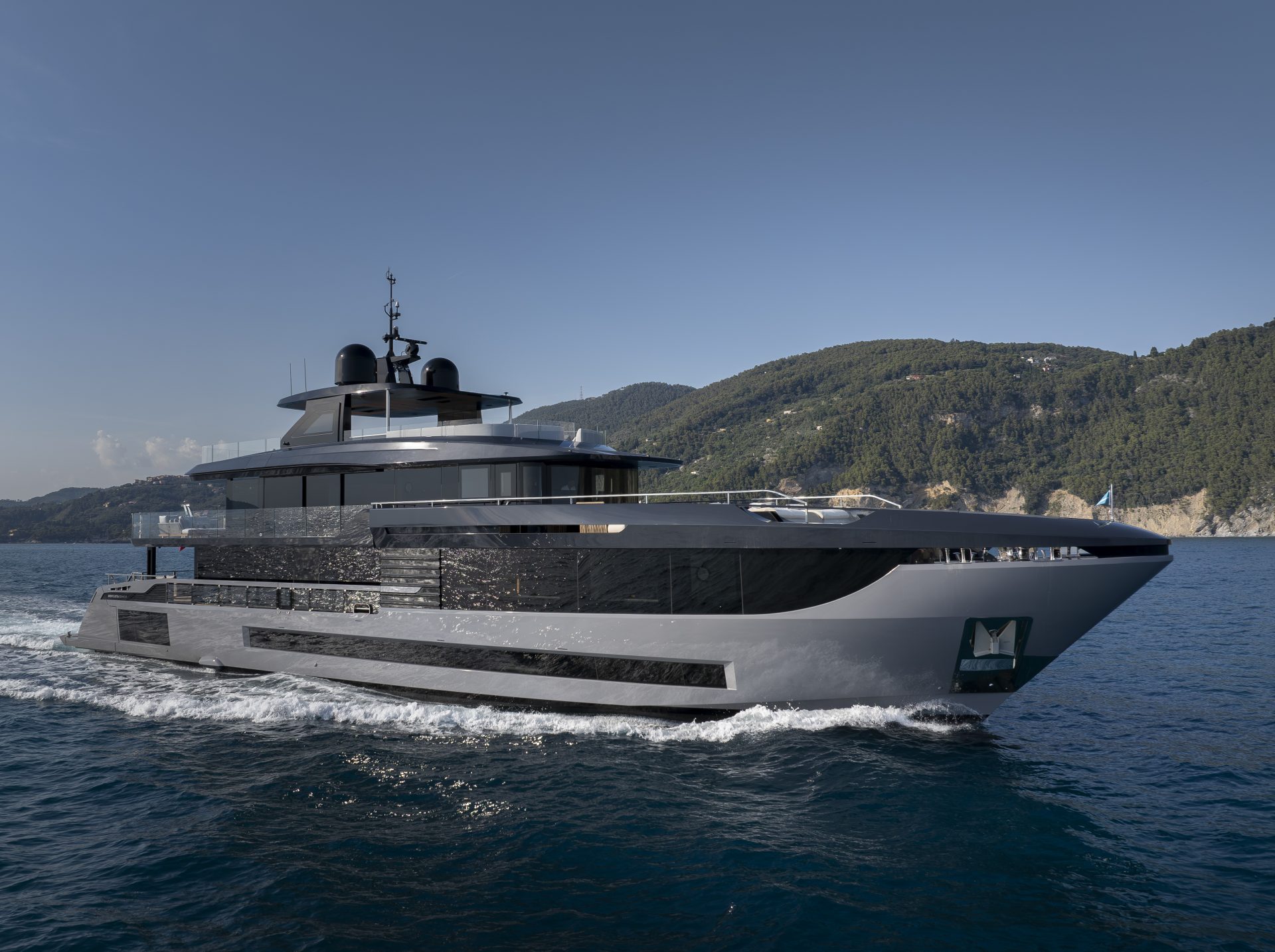 Mangusta Yacht cruising on open sea near coast