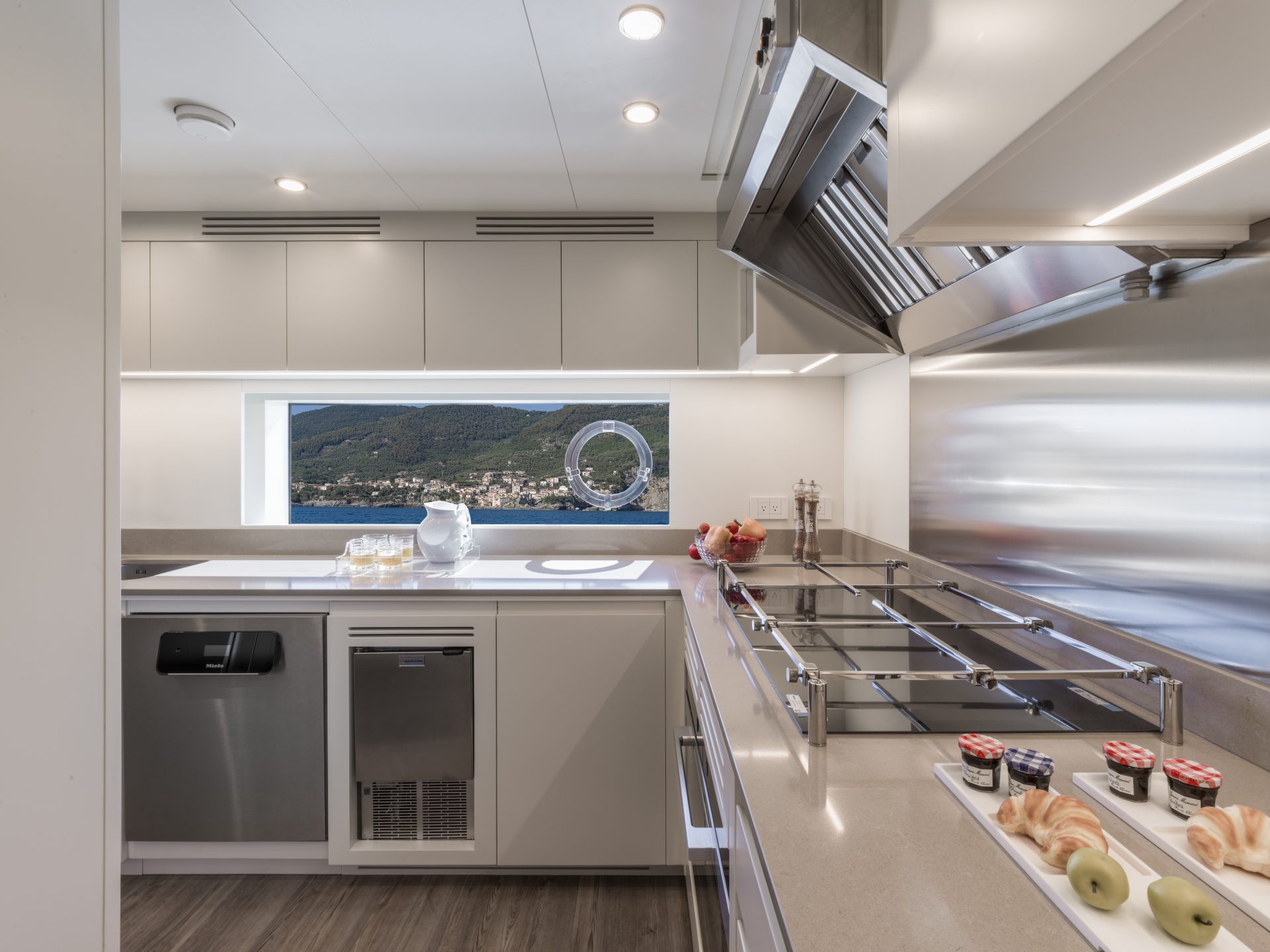 Luxury yacht kitchen with sea view window.