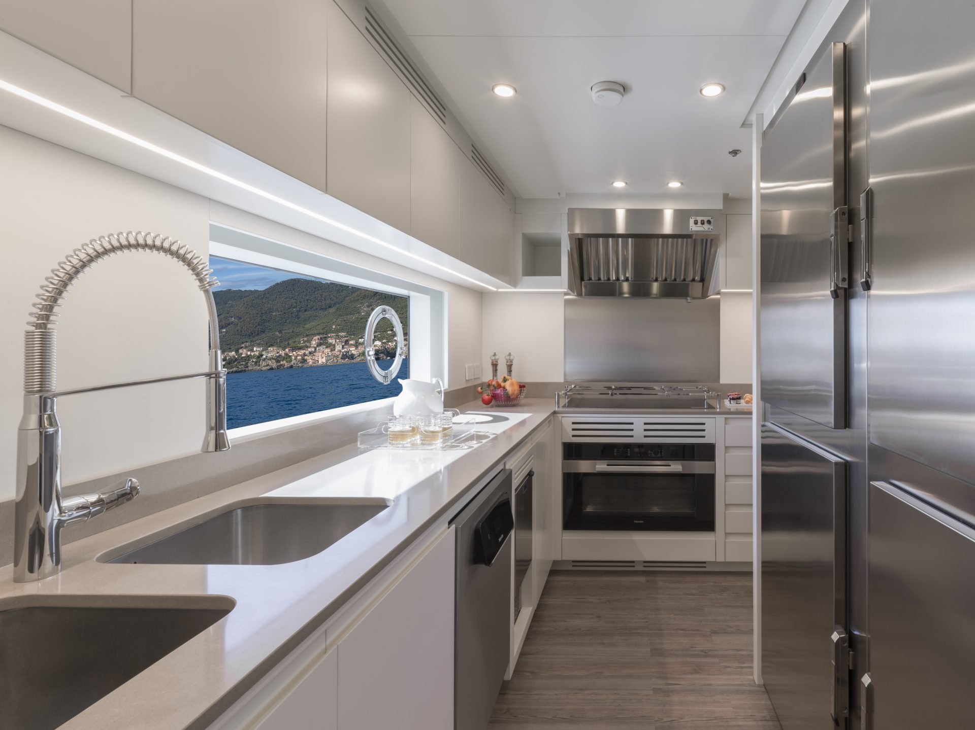 Luxurious yacht kitchen with ocean view.