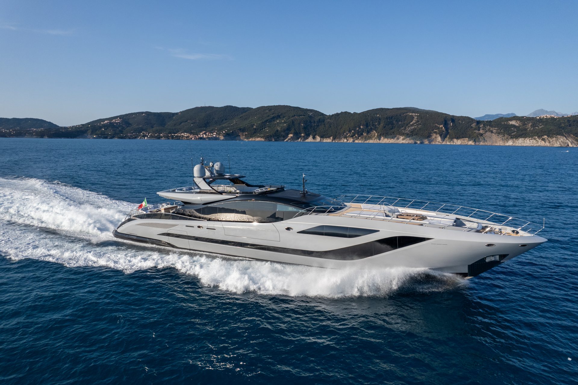 Mangusta yacht cruising on open sea.