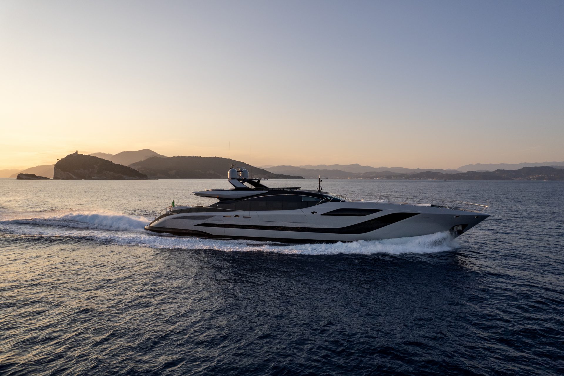 Mangusta yacht cruising in sunset waters