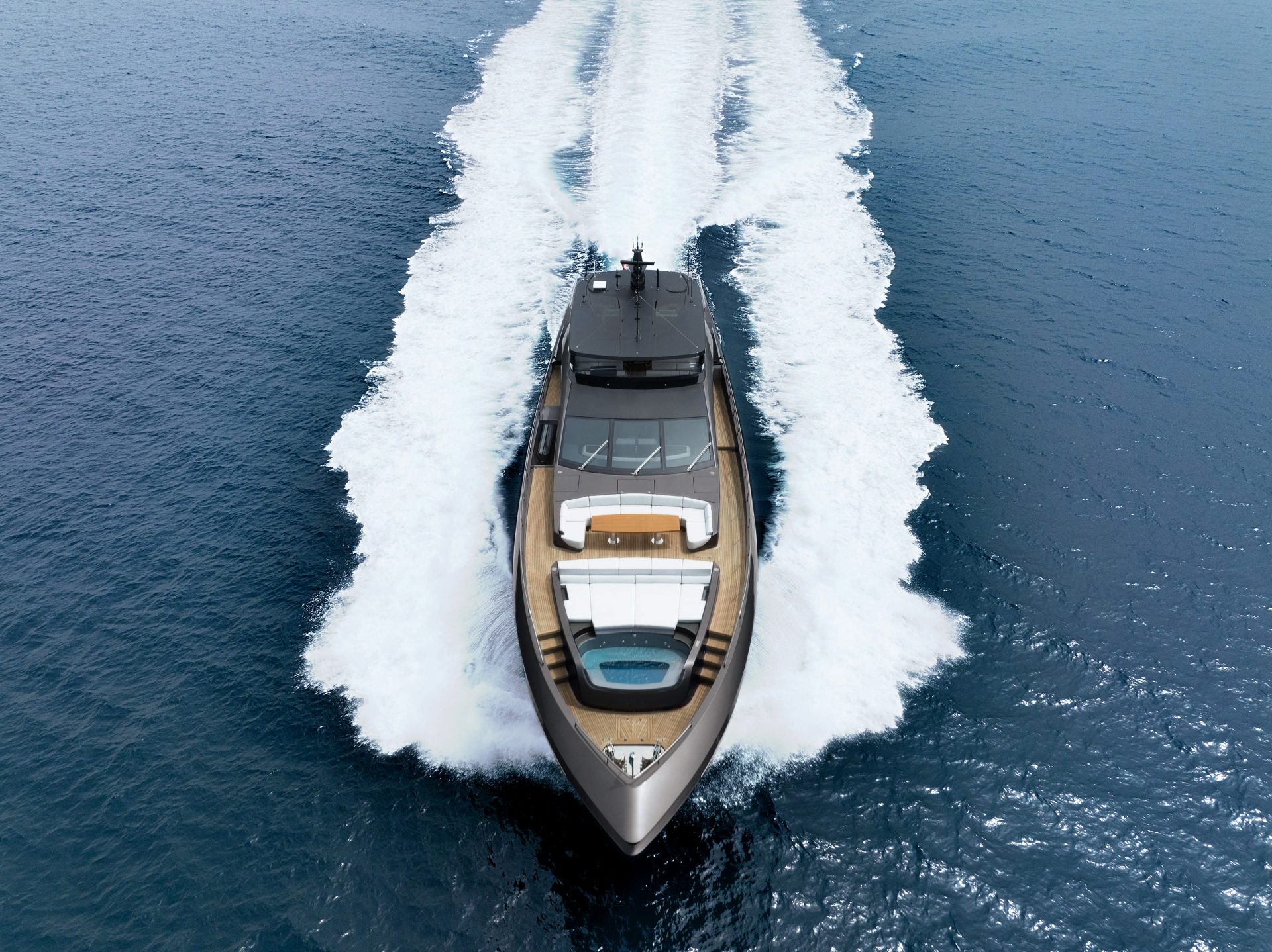 Mangusta Yacht cruising at high speed on open sea.