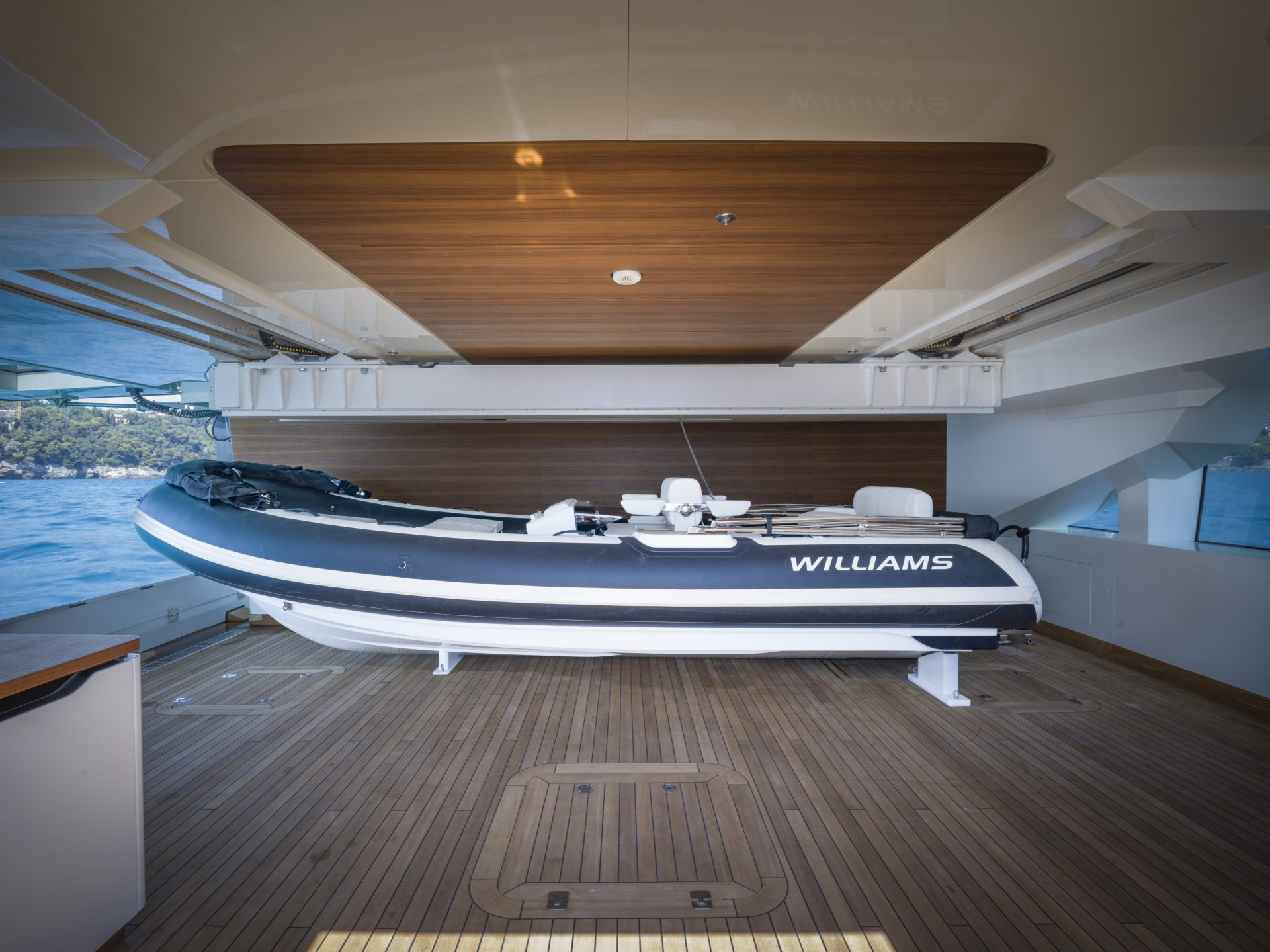 Luxury yacht tender on teak deck.