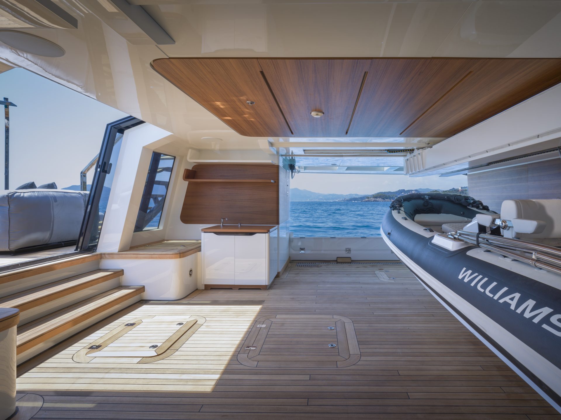 Yacht deck with dinghy and ocean view