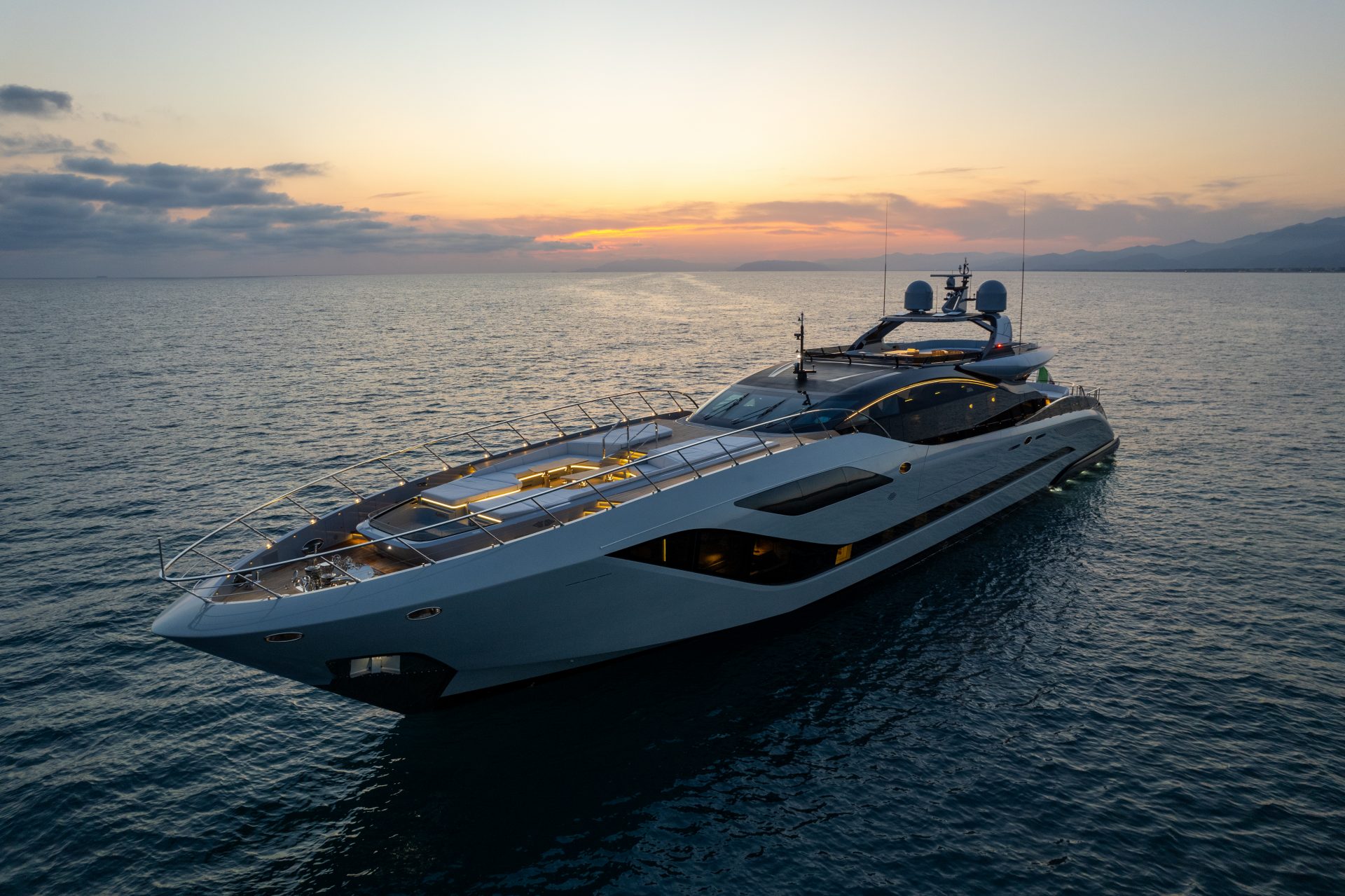 Mangusta Yacht cruising at sunset, elegant design