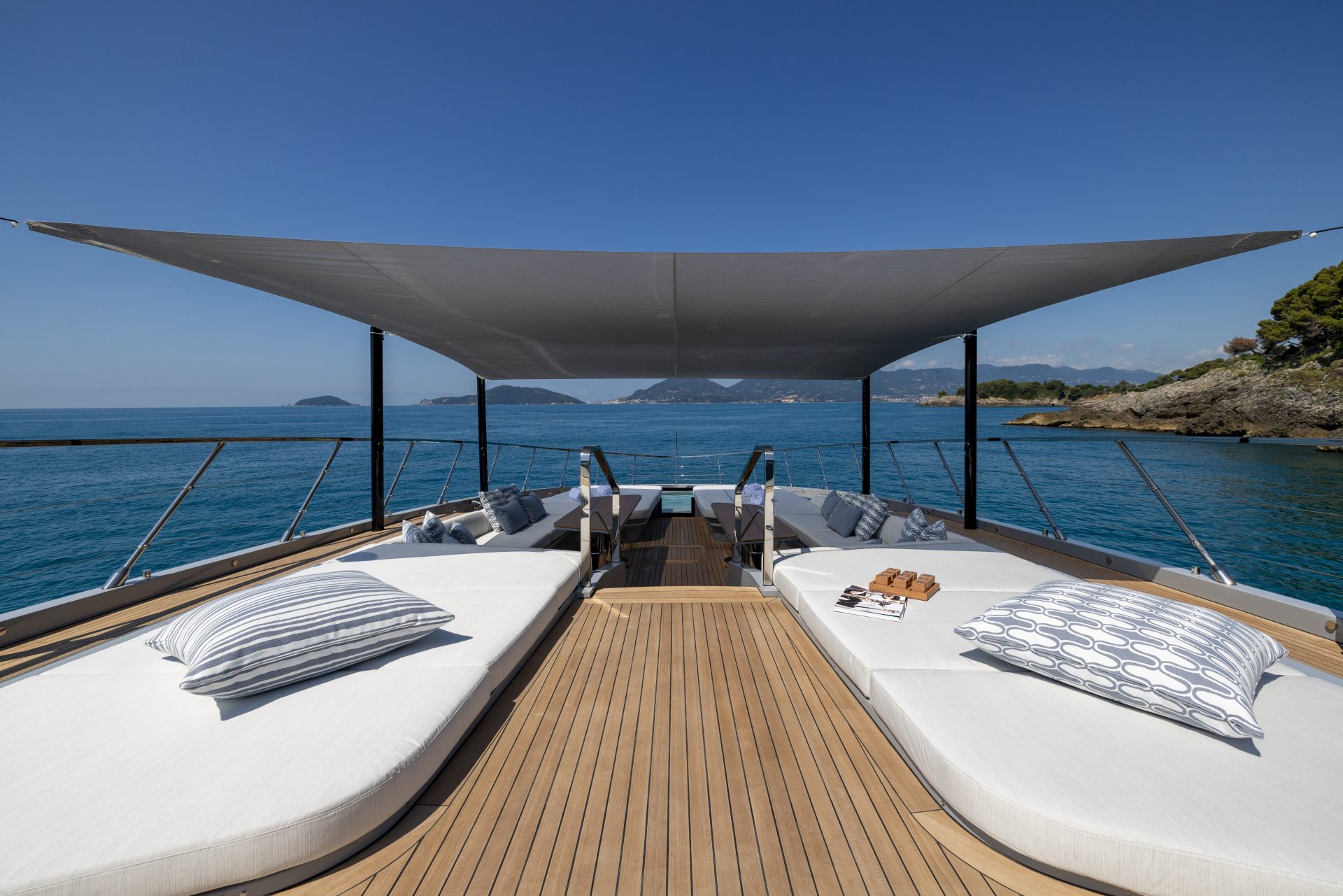 Luxury yacht sundeck with sun loungers, ocean view