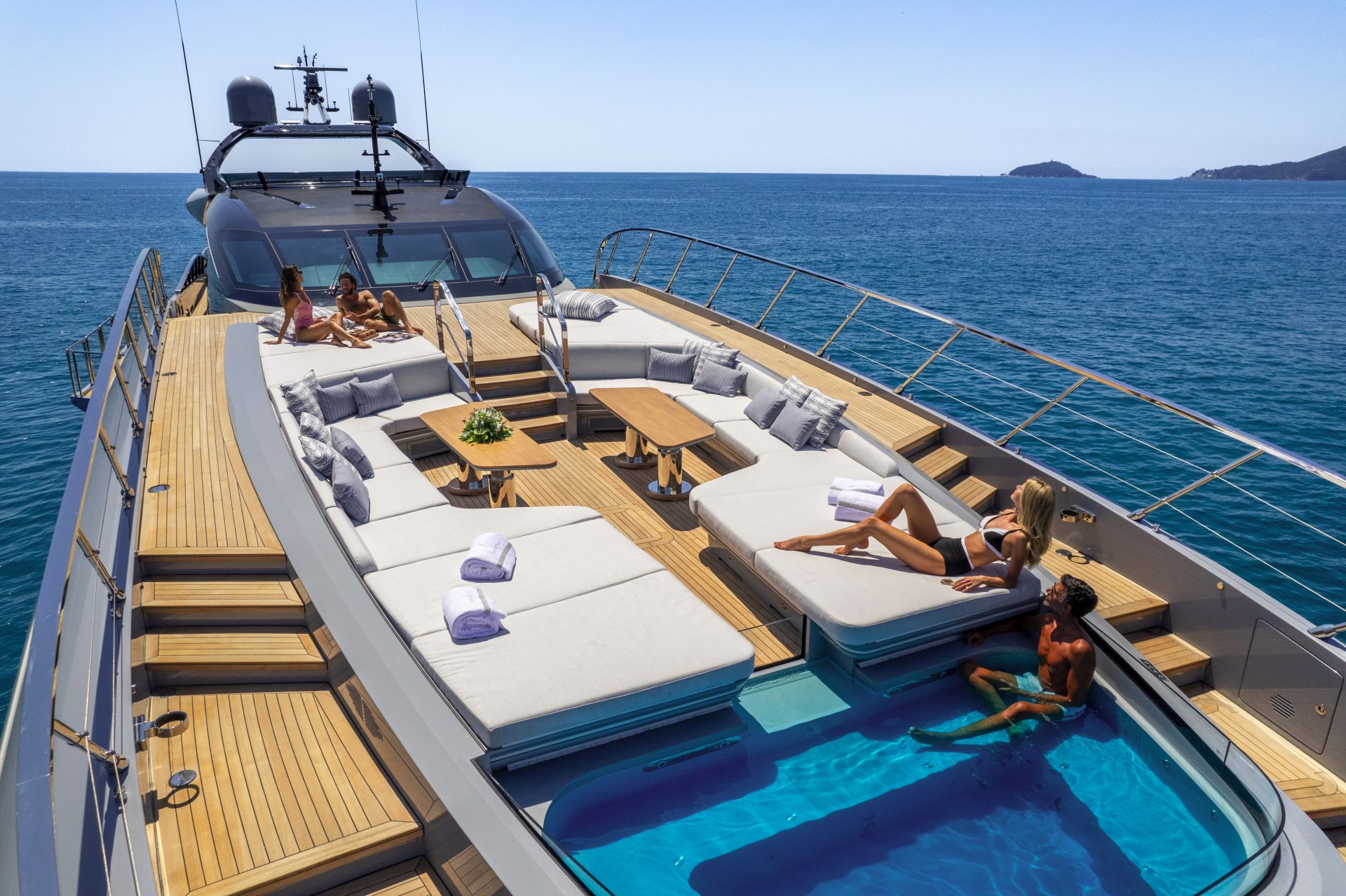 Luxurious Mangusta yacht deck with sunbathing area